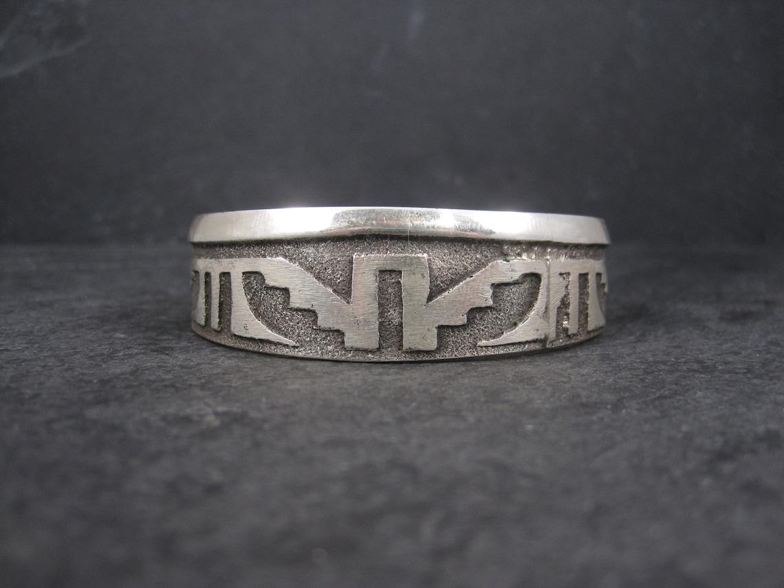 This gorgeous cuff bracelet is sterling silver.
It is the creation of the talented Navajo silversmith Anthony Bowman.

Every piece of jewelry that Anthony creates is one of a kind as each tufa stone is only used once.

This beautiful bracelet is 3/4