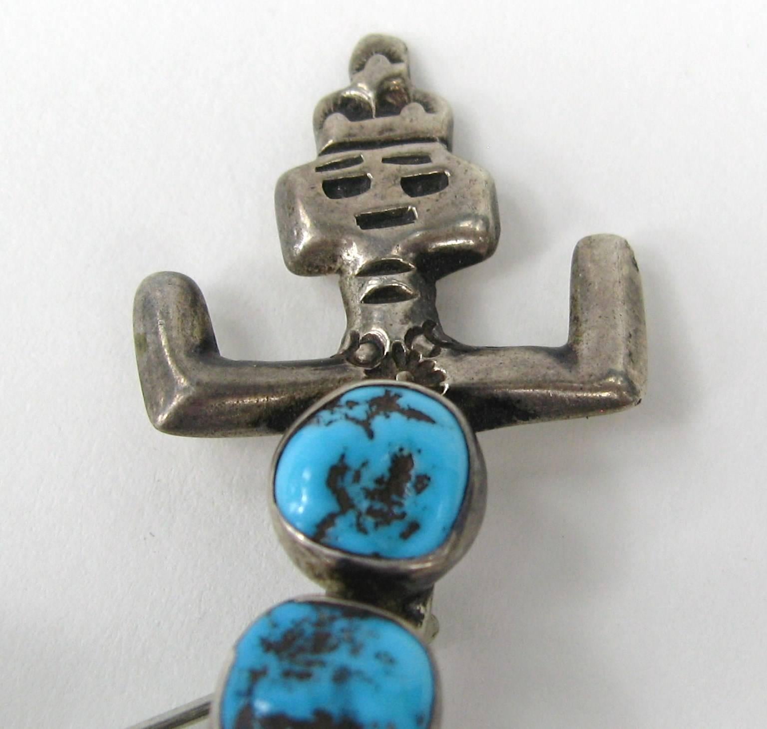 Out of a huge collection of Hopi, Navajo, Zuni and Southwestern jewelry comes this 5 Turquoise stone Dancer Brooch. Hallmarked on the back. Pin back. Measuring 2.40 in. wide x 1.50 in top to bottom. This is out of a massive collection of Hopi, Zuni,