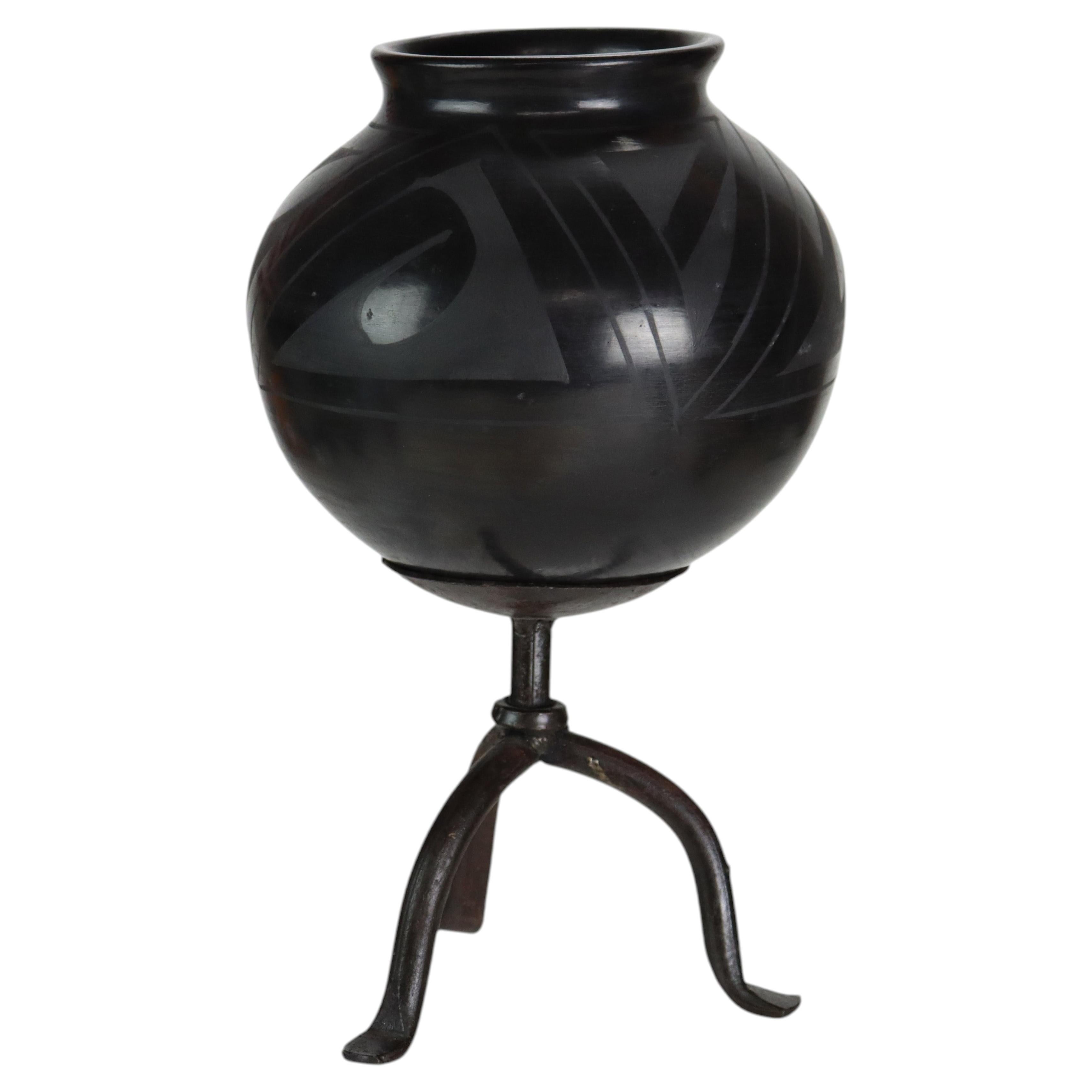 Navajo Style Black On Black Mexican Blackware Pottery Vase On Wrought Iron Stand For Sale