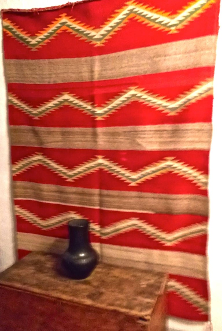 Navajo transitional blanket, circa 1880-1900.  A large blanket with strong color and design, zigzags between strong bars.