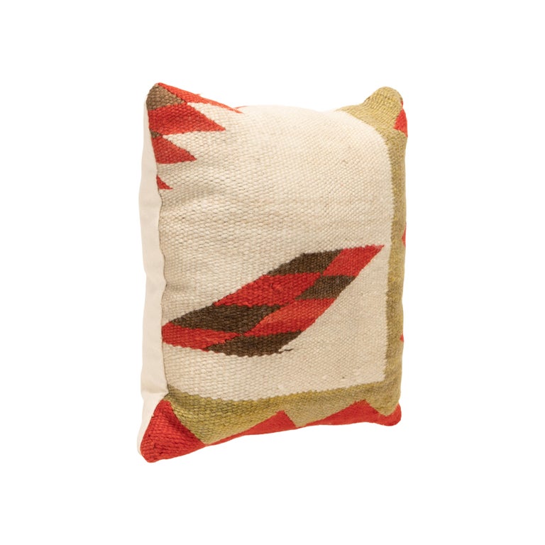 Navajo transitional pillow. Handmade pillow with front made of Navajo 1880's transitional weaving. Backed with canvas. Featuring natural dyed colors of cream, red, brown, and green. Weaving made in the late 19th Century, pillow crafted in