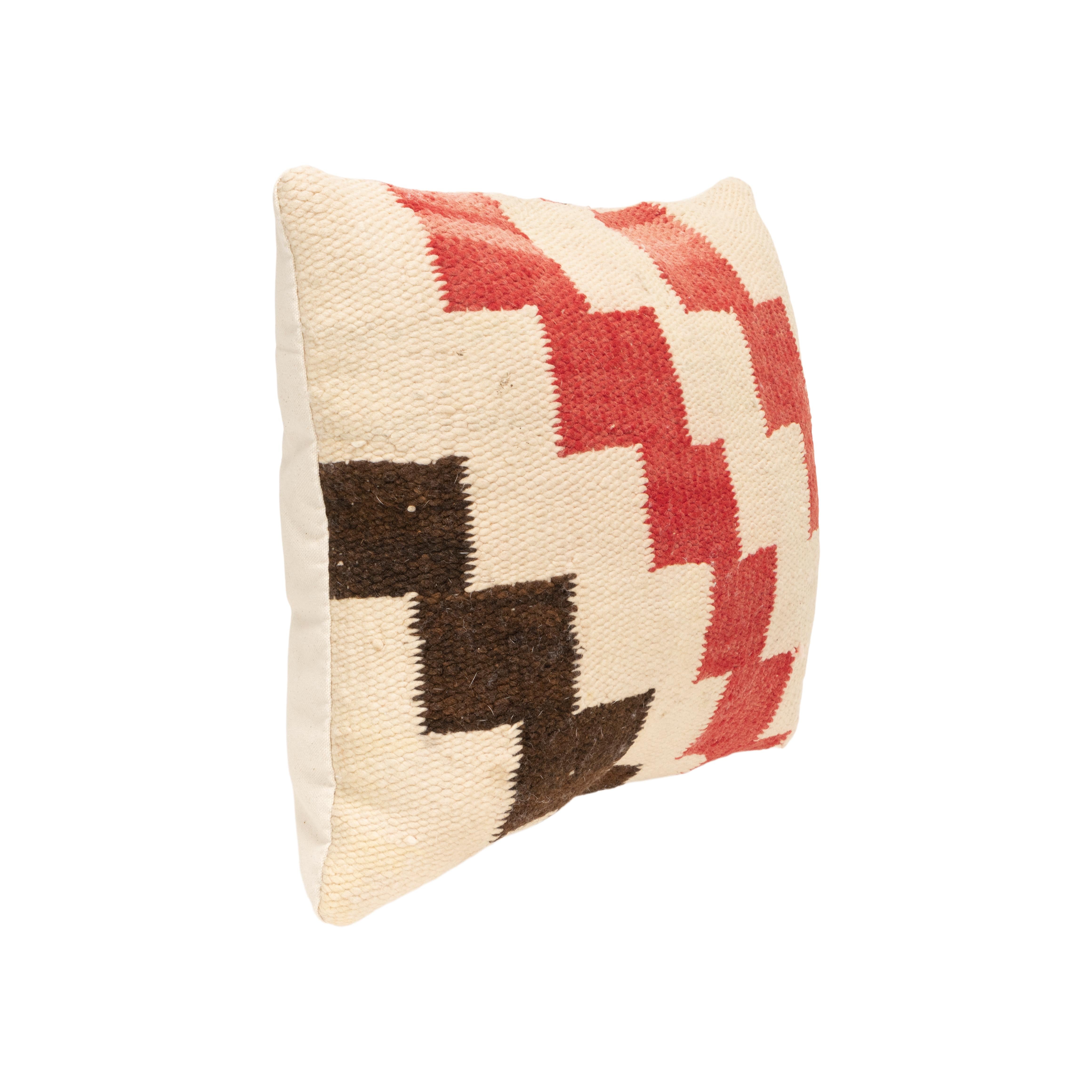 Navajo transitional pillow. Handmade pillow with front made of Navajo 1880's transitional weaving. Backed with canvas. Featuring natural dyed colors of cream, red, and brown. Weaving made in the late 19th Century, pillow crafted in 2023.

Family