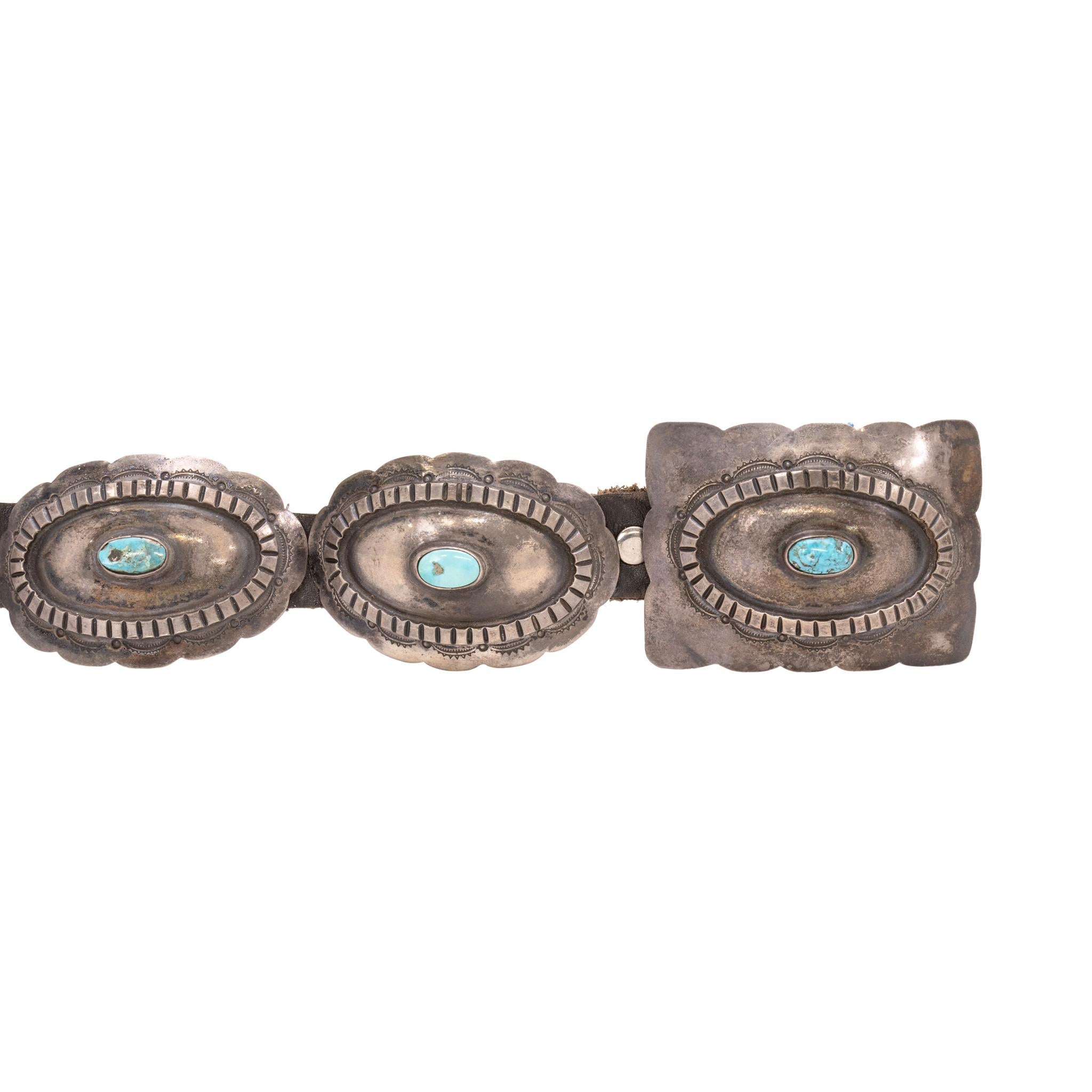 Navajo sterling silver and turquoise concho belt. The turquoise is from the Morenci Mine in Arizona, set in simple stamped conchos with great patina. Conchos are oval and buckle is rectangular, all with scalloped edge design. Each stone an oval cut