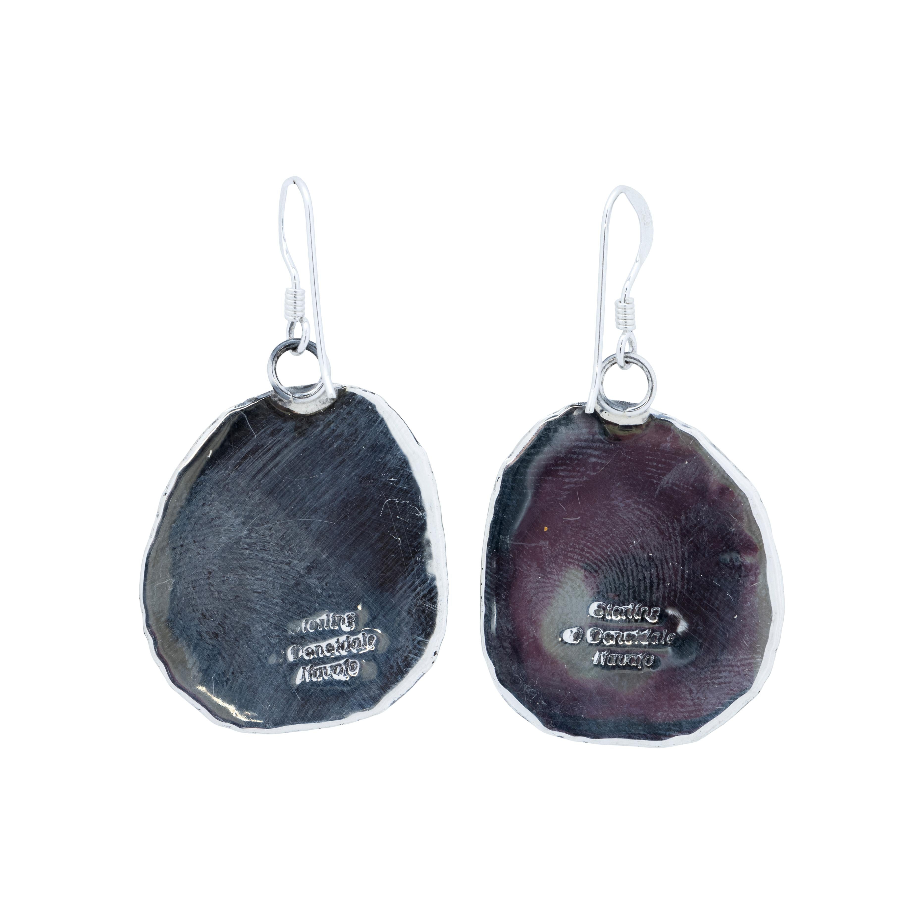 Navajo sterling silver and Kingman turquoise dangle earrings. Natural, untreated stones surrounded by a classic twisted rope border with slash marks and palmettes. Made by Navajo Silversmith W. Will Denetdale and stamped 