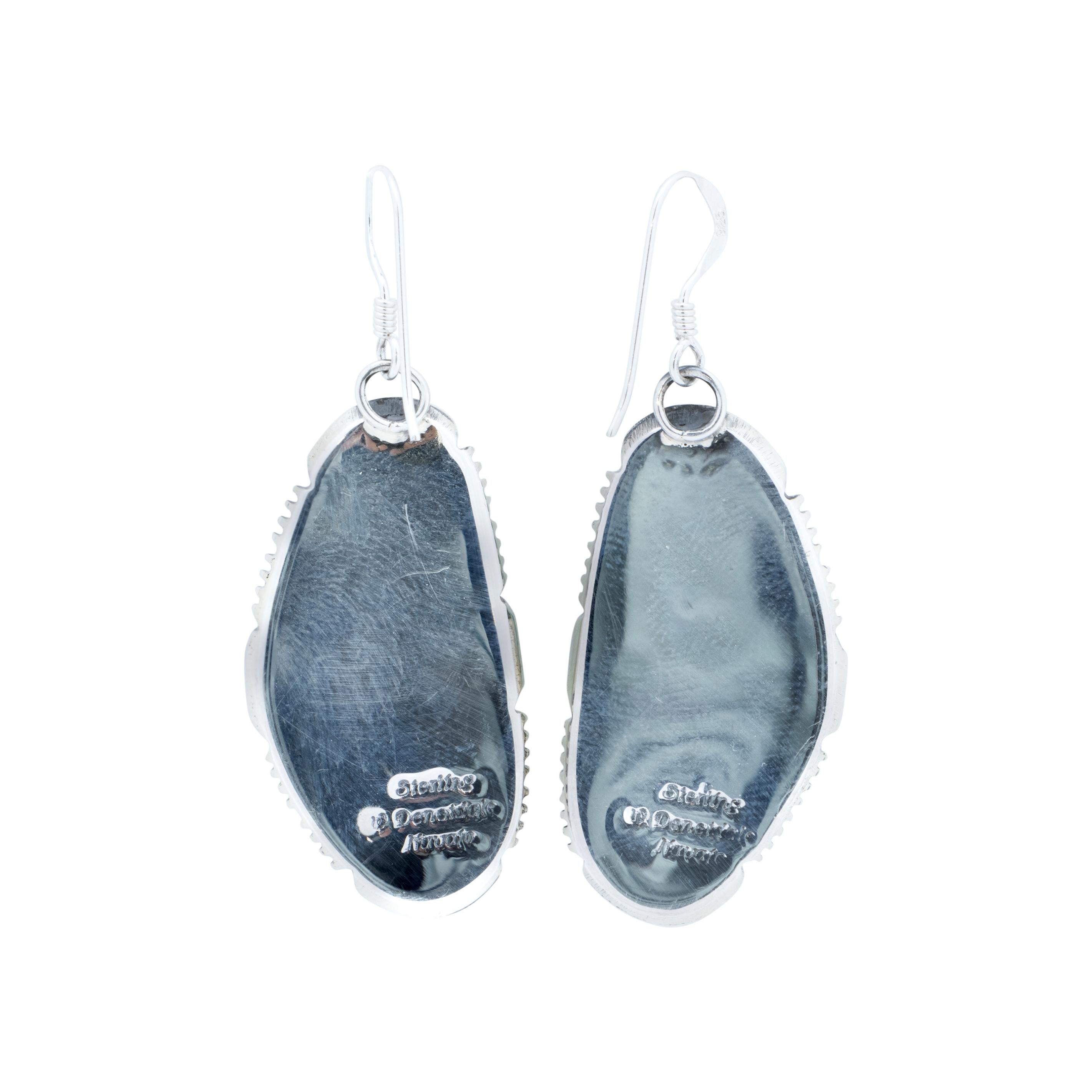Navajo sterling silver and Kingman turquoise earrings. Natural, untreated stones atop a classic twisted rope border with slash marks and hand stamped palmettes. Made by Navajo Silversmith W. Will Denetdale and stamped 
