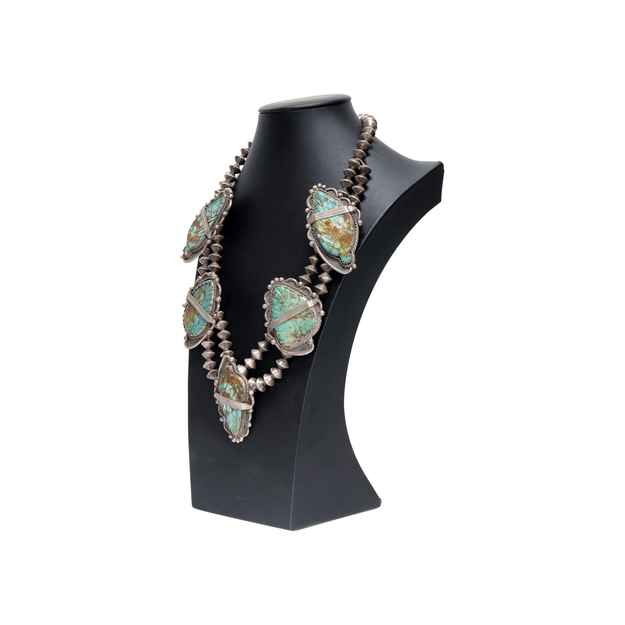 Exceptional Navajo turquoise and sterling silver necklace. Five large turquoise slabs cut in shape of leaf with etched leaf vein details, each approximately 3