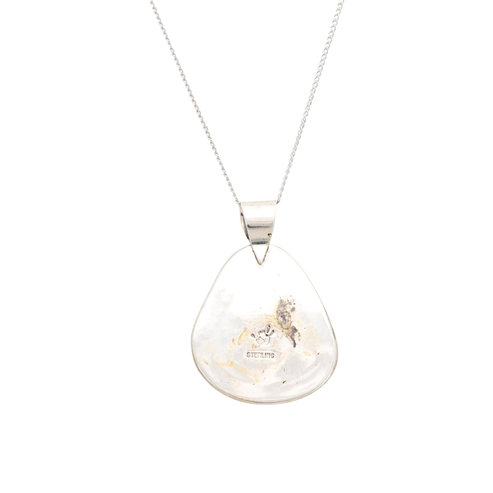 Navajo sterling silver and No. 8 turquoise pendant on simple sterling silver chain. Natural Grade A quality, untreated stone set in a classic sterling twisted rope border. Stamped 
