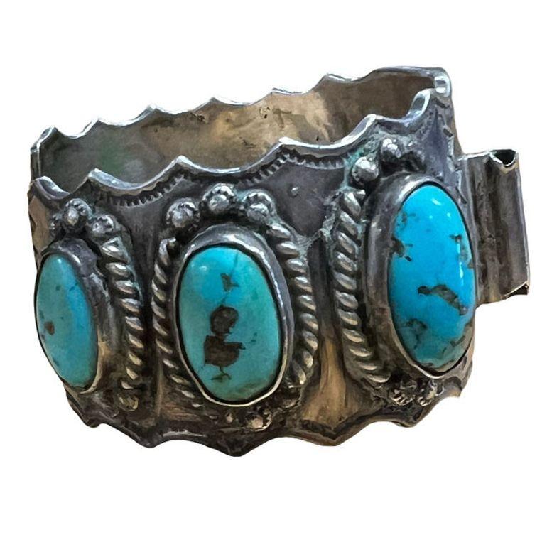 Navajo silversmith watchband/cuff, a classic combination of heavy silver and American turquoise stone by jeweler Alberto Contreraz. The cuff is filled with a magnificent collection of Kingman Turquoise stones. Alberto loved working with heavy silver