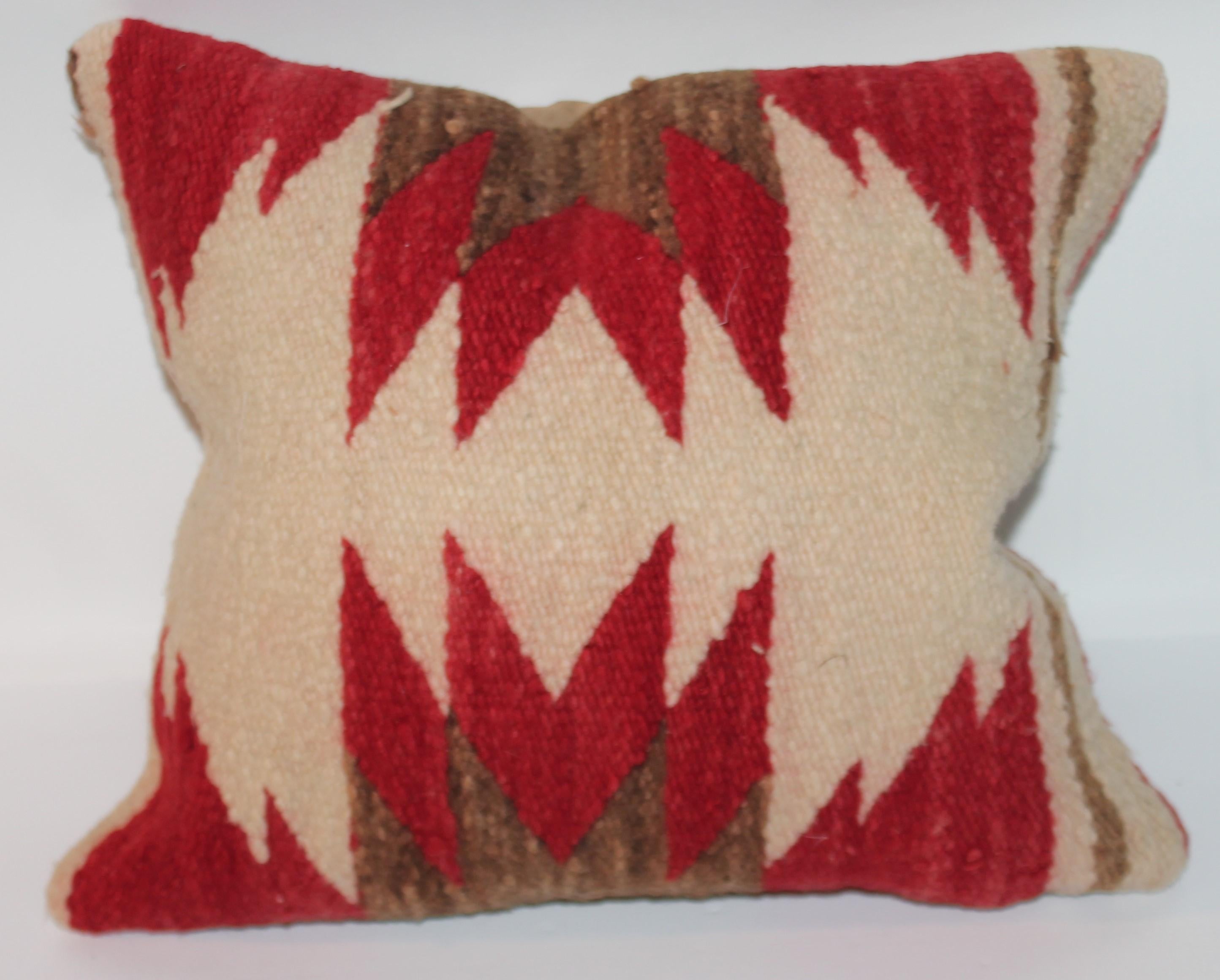 Decorative Navajo Indian weaving pillow with Suede back. New feather and down insert.