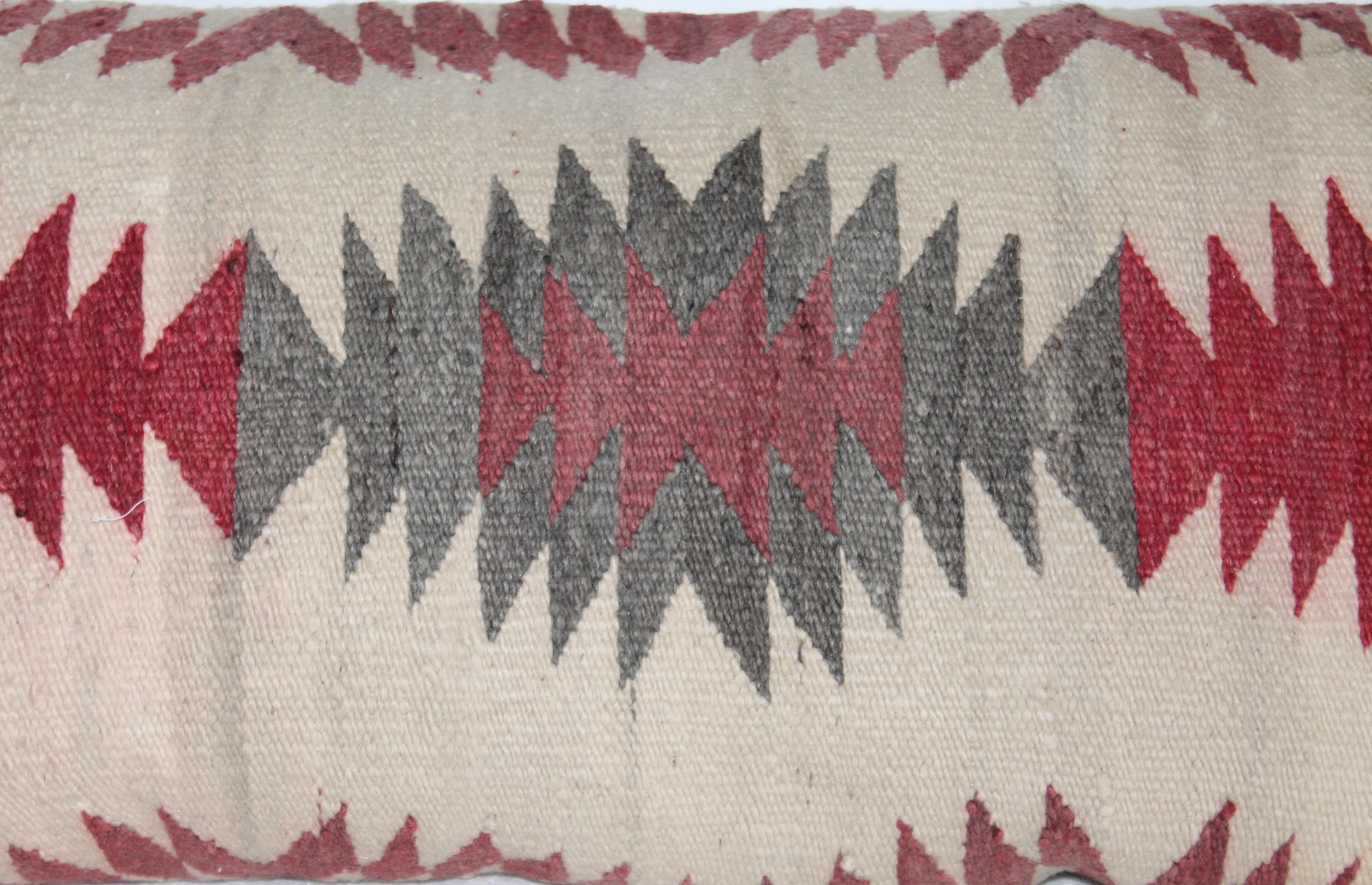 Navajo Indian weaving / saddle blanket pillow with leather backing. The condition is very good. It is down and feather fill.