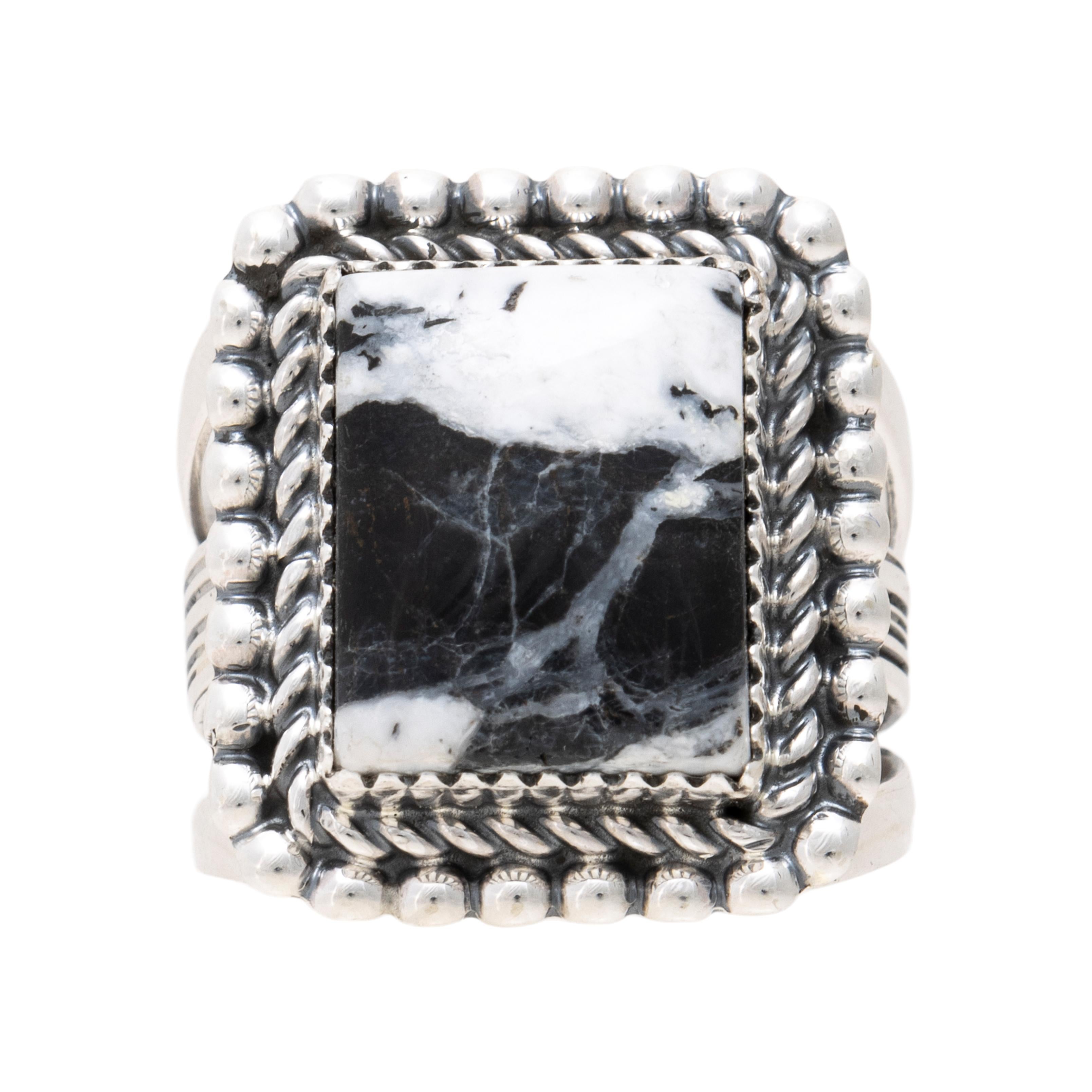 Native American Navajo Indian sterling silver and White Buffalo turquoise ring by Avin Joe. Featuring a large square shaped natural, untreated stone set in sterling silver with classic twisted rope border. Stone has a stark black and white coloring
