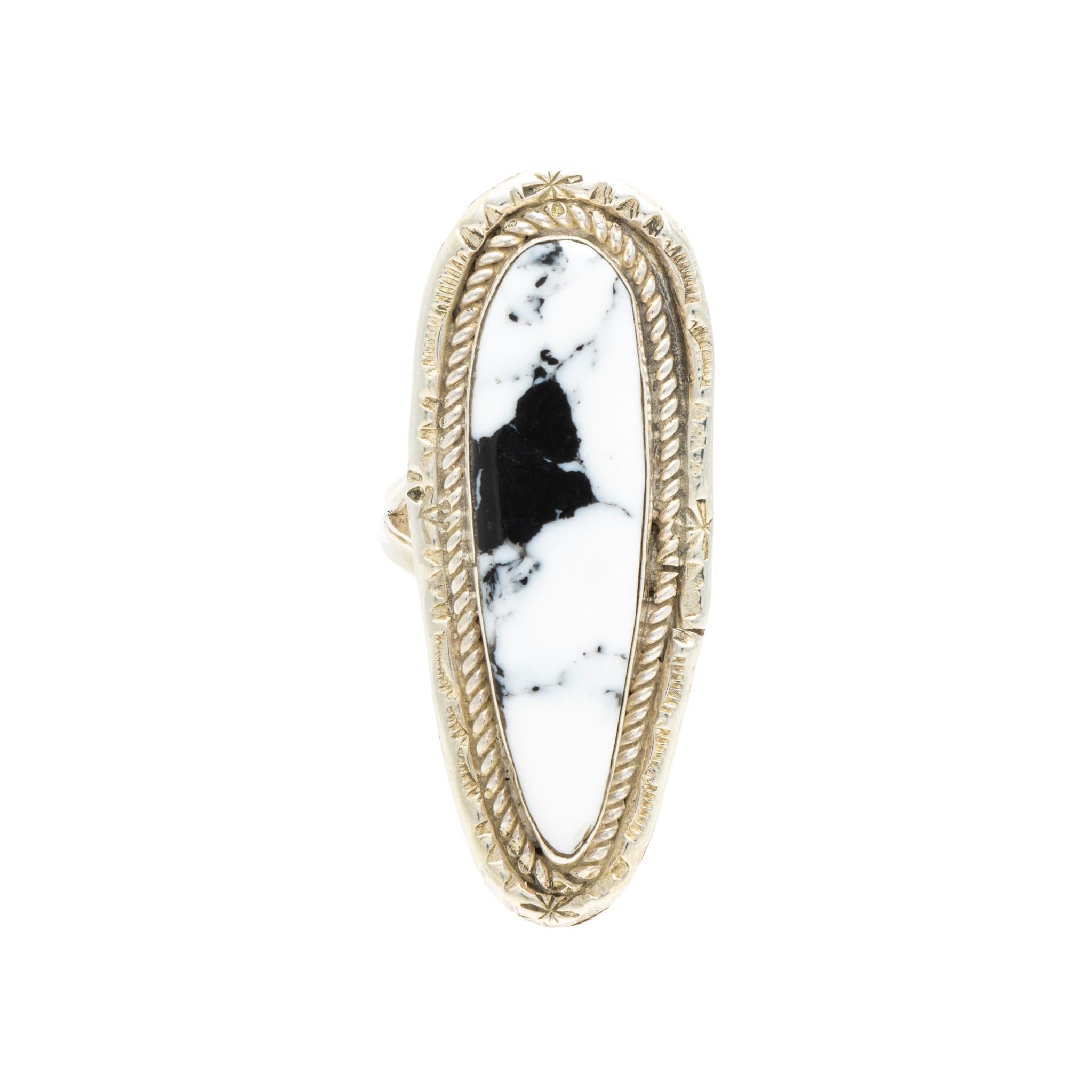 Native American Navajo Indian white buffalo turquoise ring set in sterling silver. Large center stone surrounded by classic twisted rope border having hand stamped palmettes. Maker's initials 