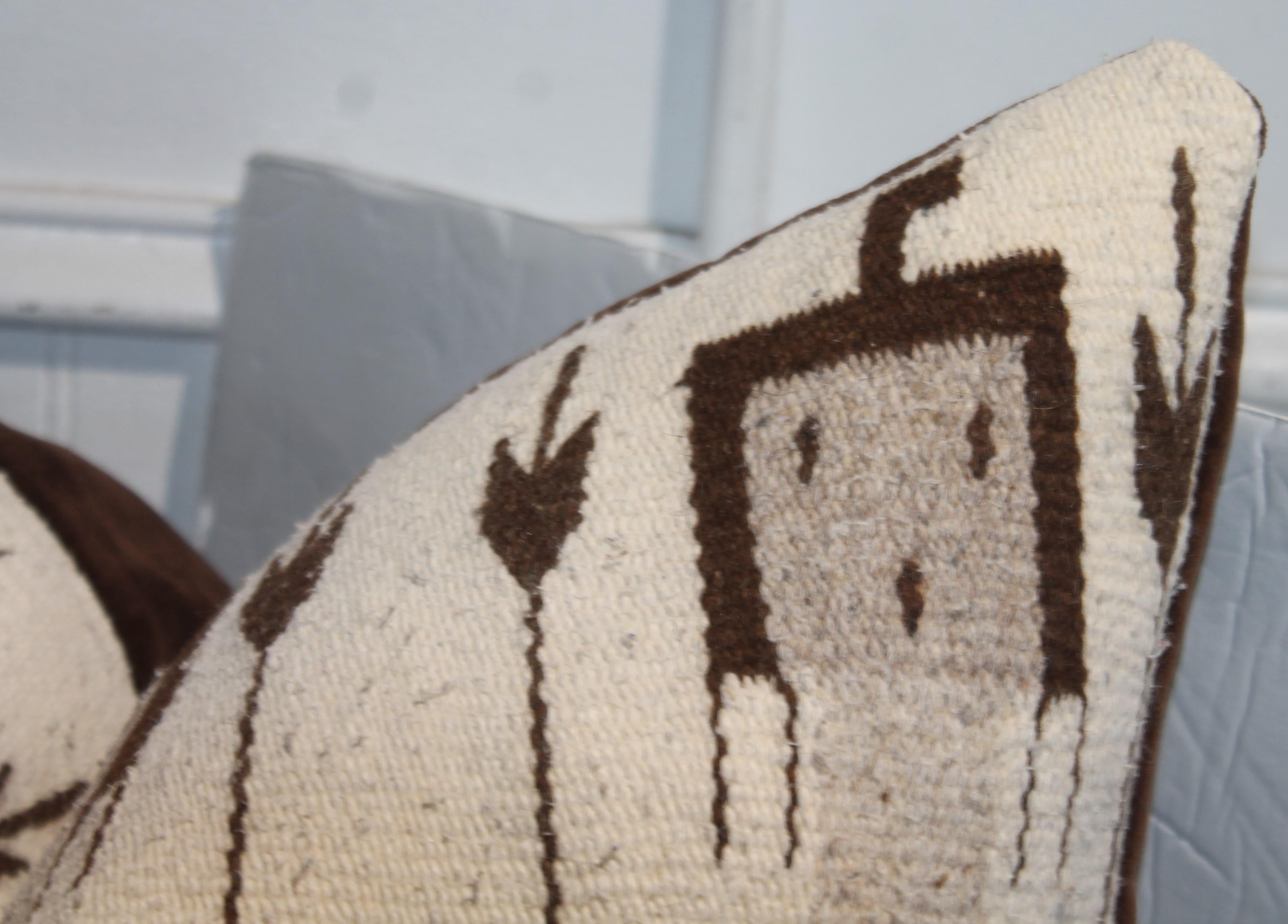 These Navajo Indian weaving pillows are in fine condition and have brown mohair backings.These are in very good condition.