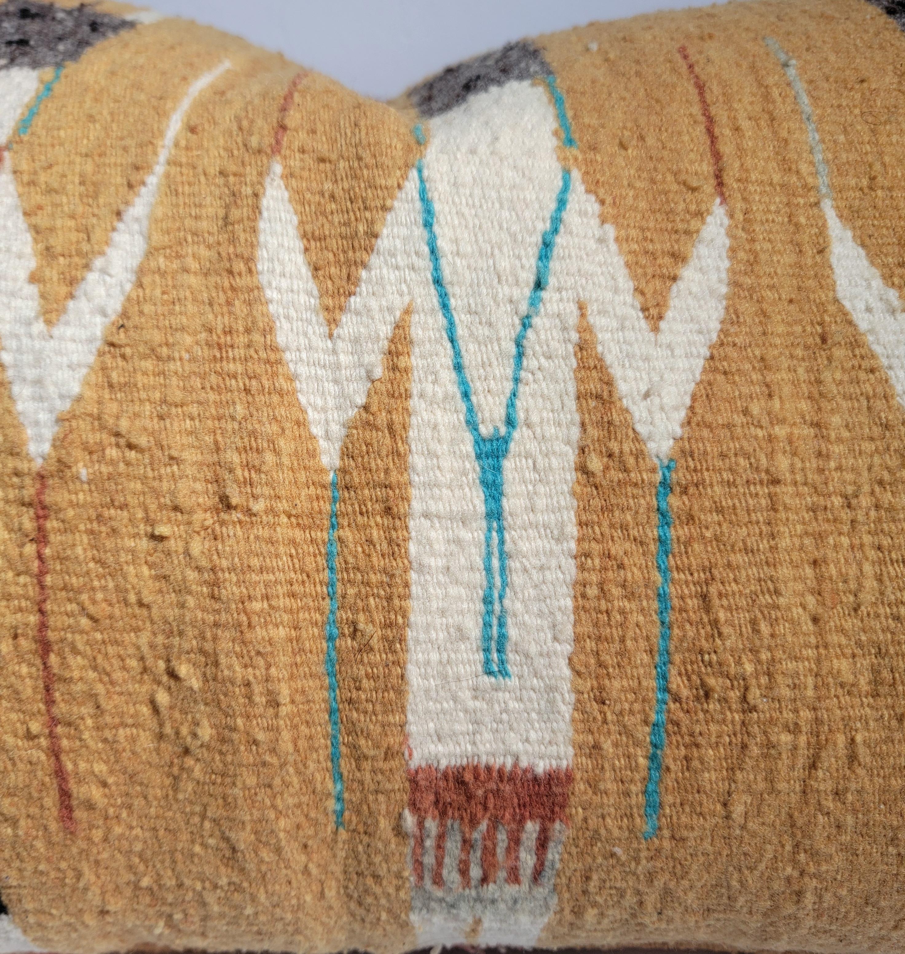 Navajo yei woven pillows with brown leather backing. The lather backing may be used as the main side as it also has a great look to it. The yei weaving has the yei corn dancers in front. Wonderful brighter color pallet. Beautiful colors. 