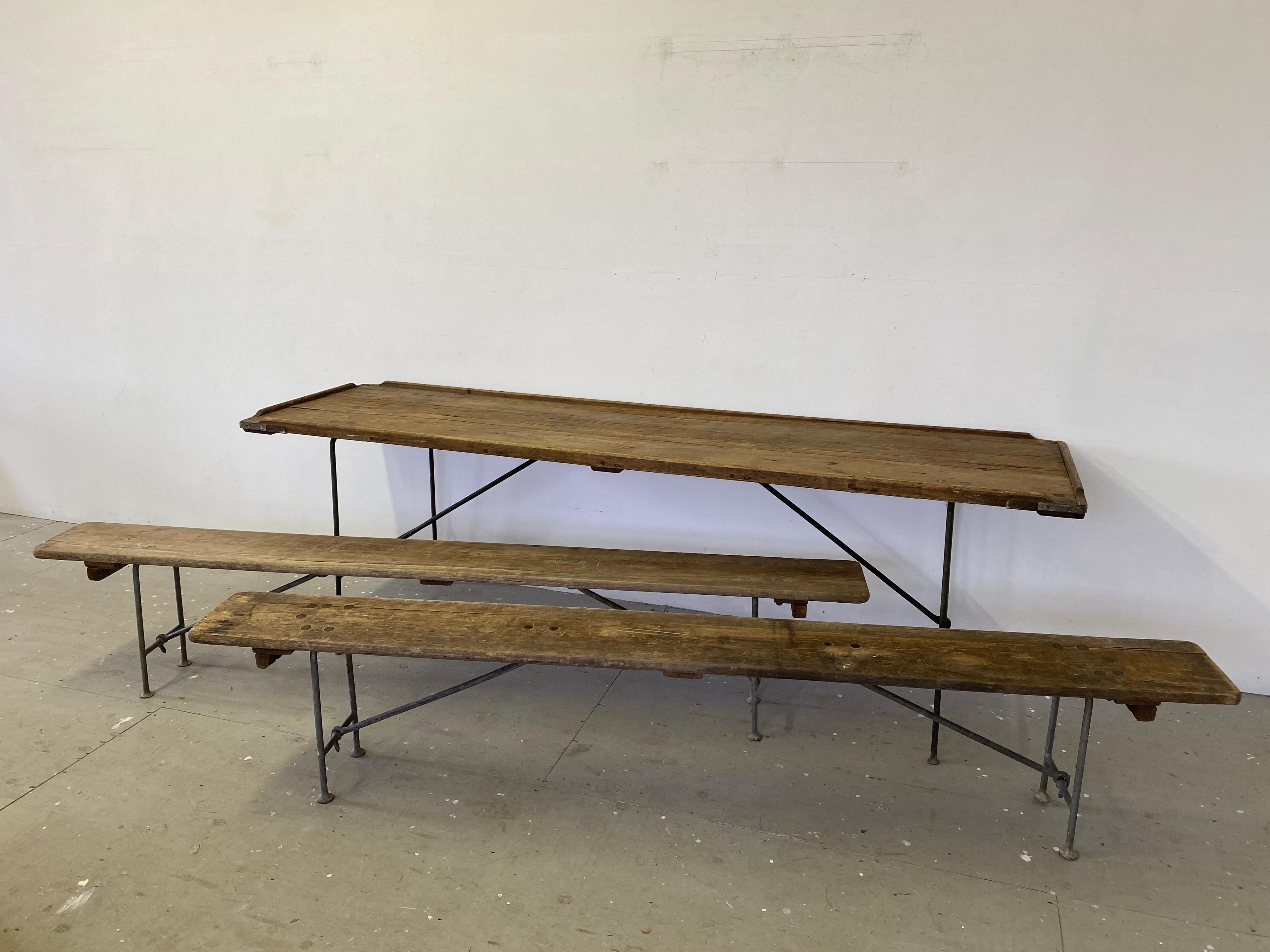 1930s naval/ aircraft carrier table and 2 matching benches. Beautifully engineered and solid folding table and benches! Heavy metal legs fold open or shut to allow for easy set-up! I have had the benches before, but never a table! Table has a lip