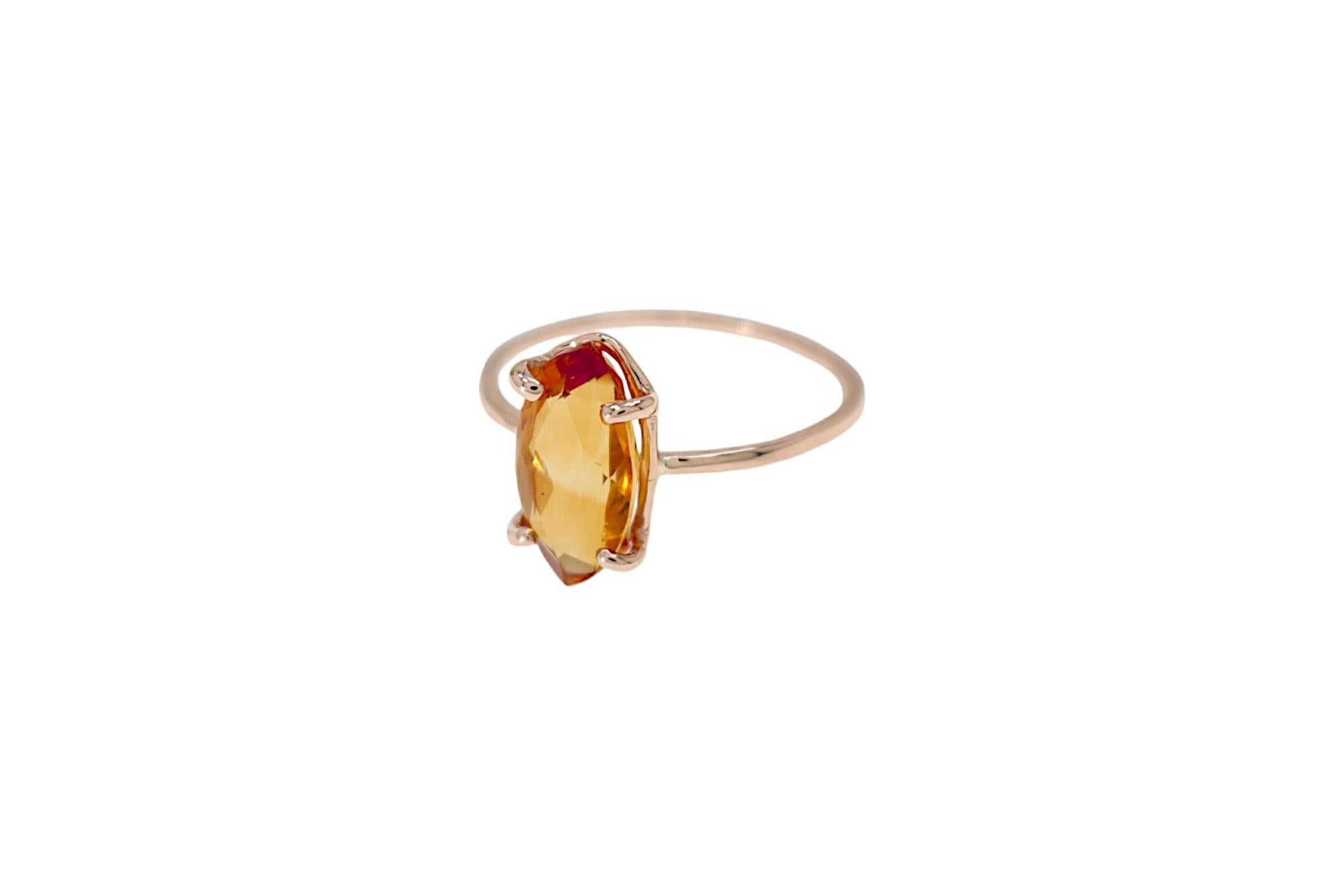 Contemporary ring handmade in 9 carat rose gold with navette cut citrine, 0.47x0.23 inches. Finger size: US size 6, Italian size 12, UK size M, French size 52. The ring can be re-sized to the customer's size before shipping. Marked with 9 carat gold