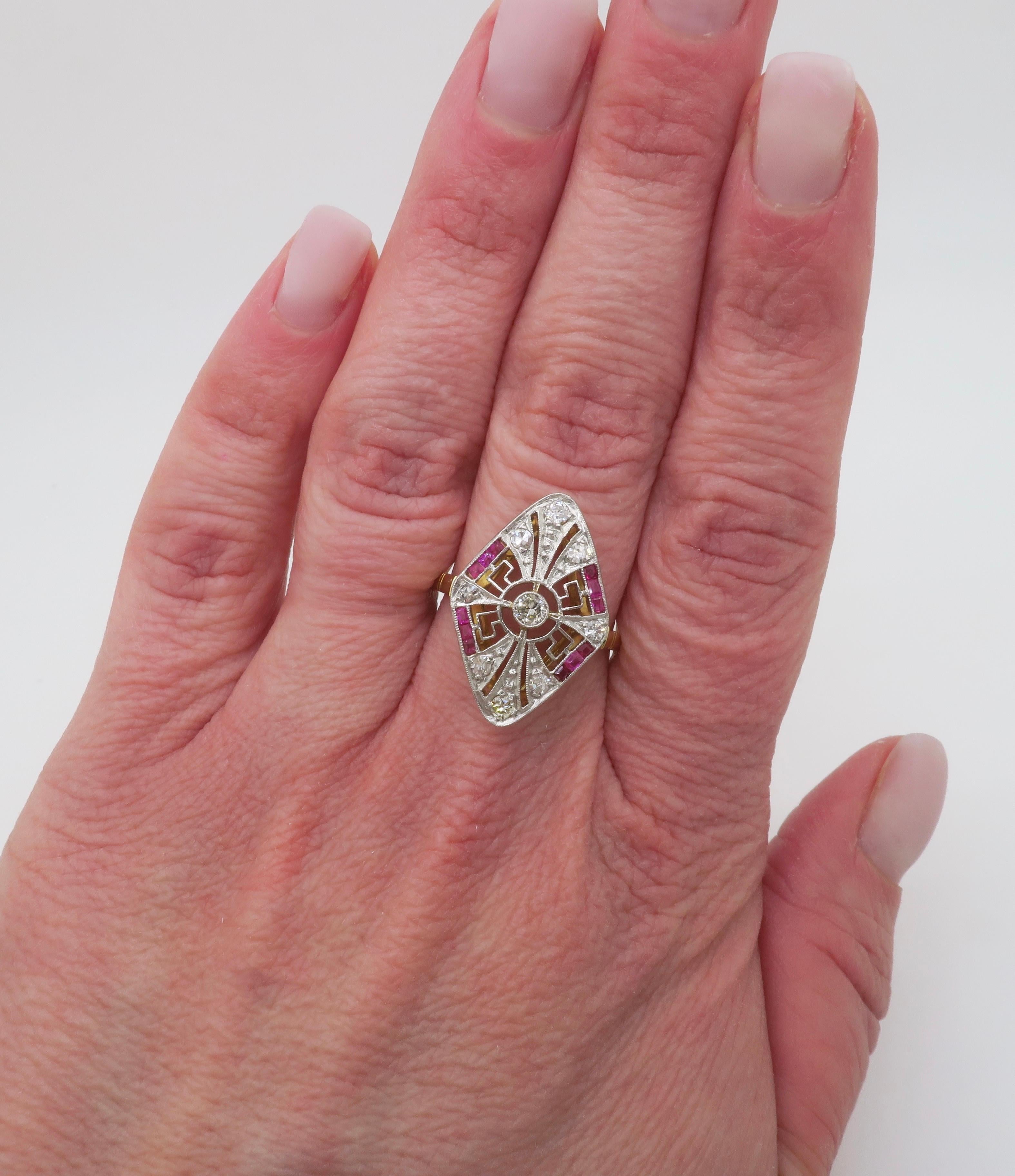 Stunning vintage Diamond & Ruby navetté ring made in 18k white & yellow gold. 

Diamond Carat Weight: .55ctw
Diamond Cut: Round Brilliant & Round cut 
Color: F-H
Clarity: VS1-SI2
Gemstone: Ruby
Metal: 18k White & Yellow Gold 
Stamped: 