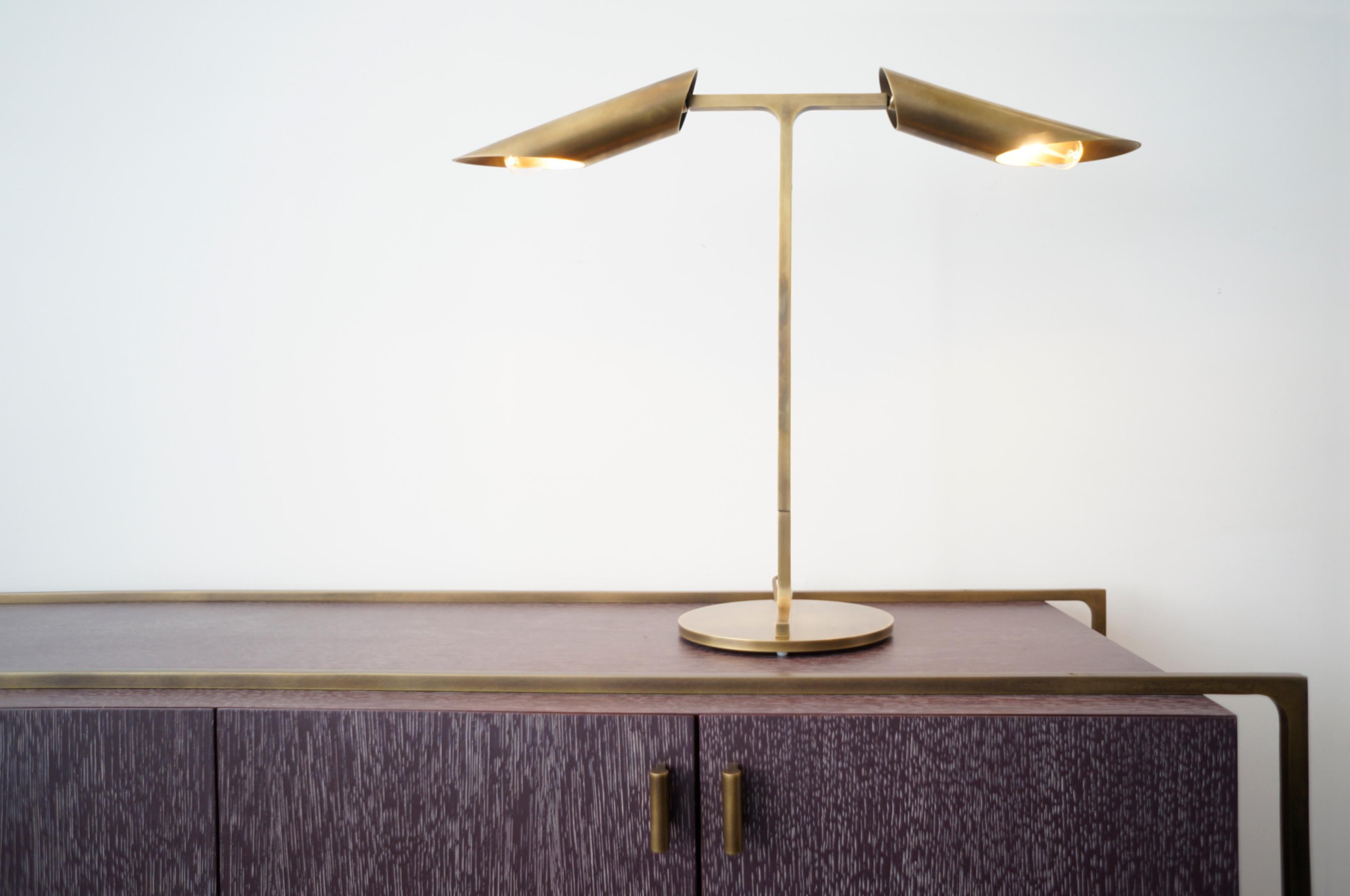 Inspired by aeronautical aesthetic references from planes propellers and their mechanics, the Navis collection uses a rounded “T” shape solid brass connector as main component from where the shades are articulated and pivoted shade configuration.