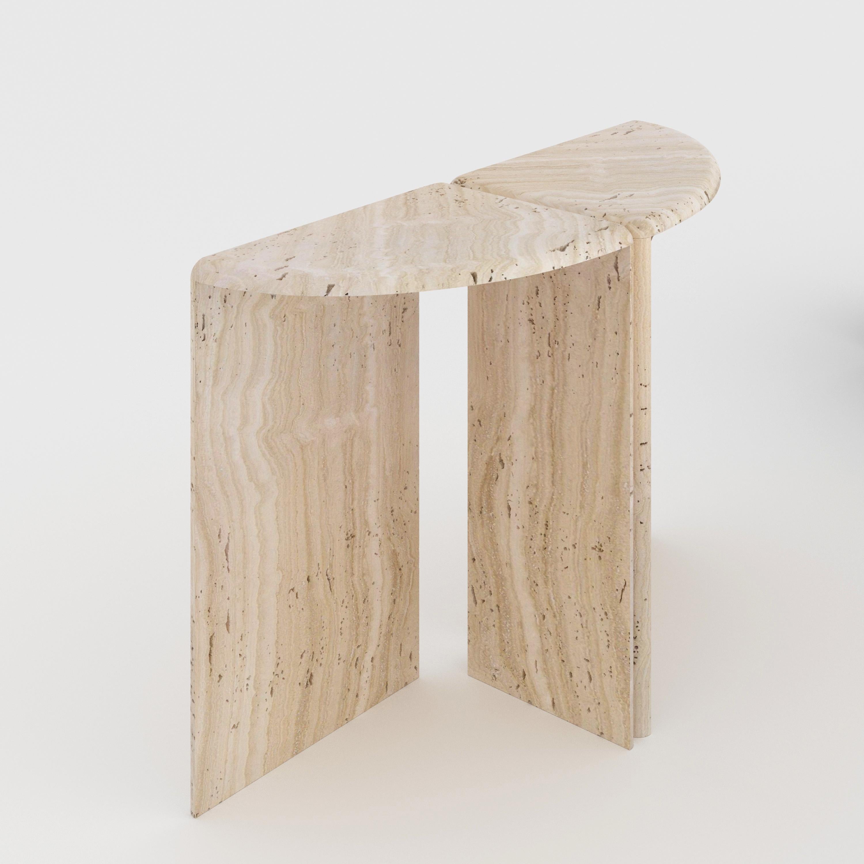 Navona Travertine Lily Console Table by Fred and Juul
Dimensions: D 43 x W 122 x H 85 cm.
Materials: Navona travertine.

Fred&Juul, short for Federico Minarelli and Julie Janssen, are two architects who decided to work as architects isn’t for them.