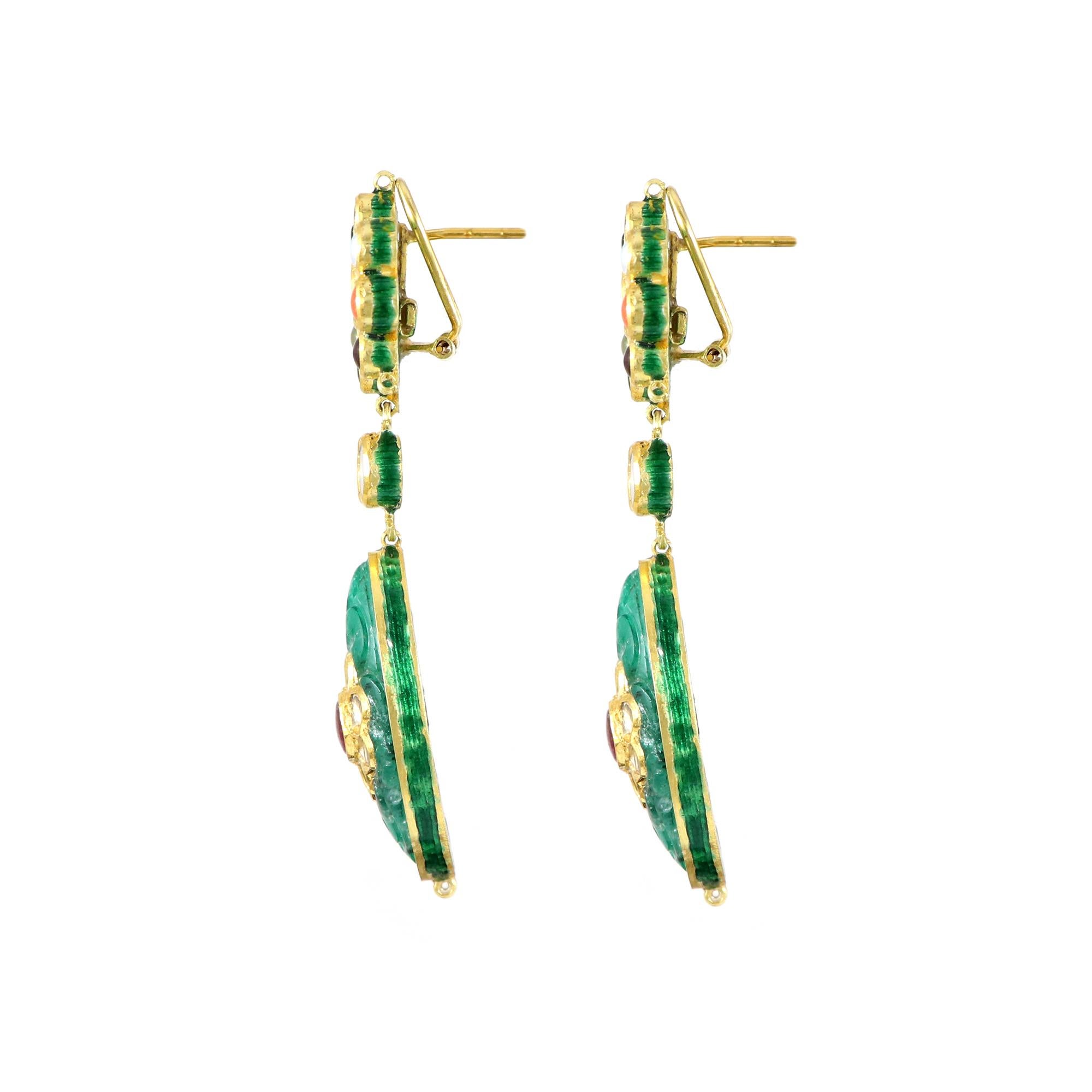 Behold a masterpiece of artistry – our divine carved gemstone earring, a testament to India's cultural heritage through intricate jadau work. This earring boasts Zambian emerald and a mix of vibrant colored stones, also known as Navratan. This