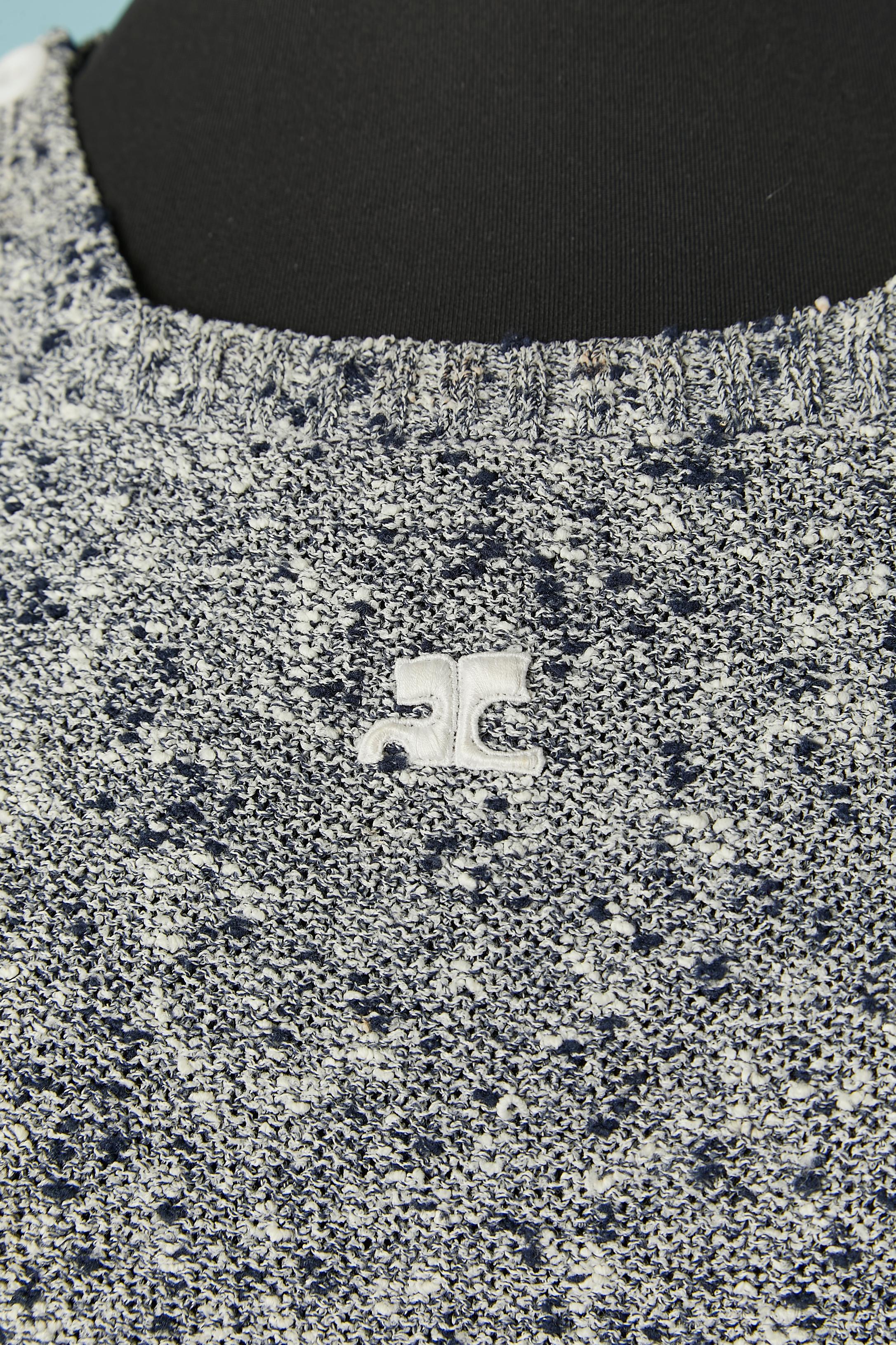 Navy and white knit chiné sweater. Knit composition: 64% triacetate, 18% polyamide, 18% polyester. 
Button and buttonhole on the shoulder and pocket on both side. 
SIZE M ( 
