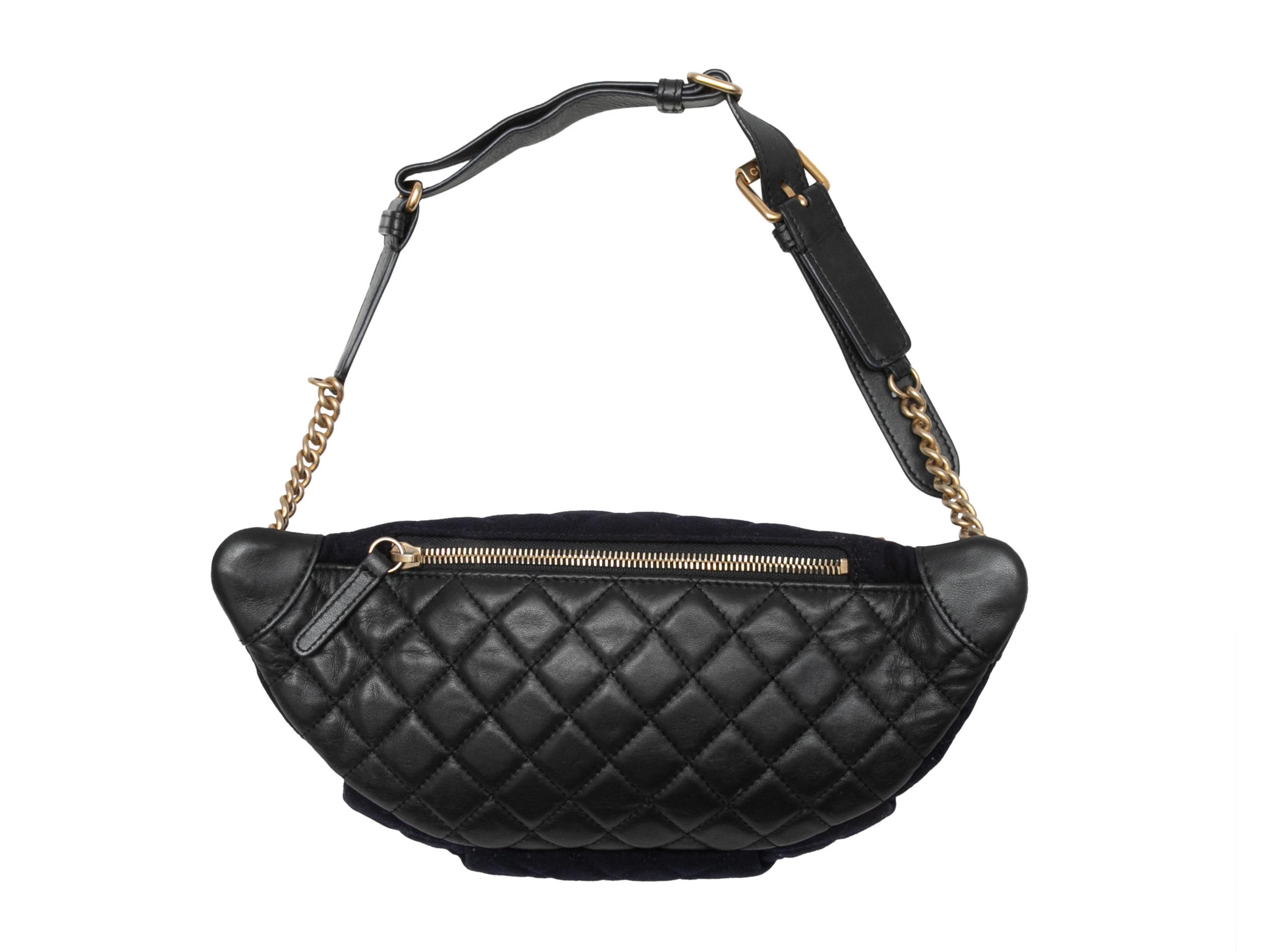 Navy & Black Chanel 2018 Quilted Nautical Waist Bag. *Marked as a sample piece. This waist bag features a textile and leather body, gold-tone hardware, a single leather and chain-link waist strap, nautical pin embellishments, and a front zip pocket.