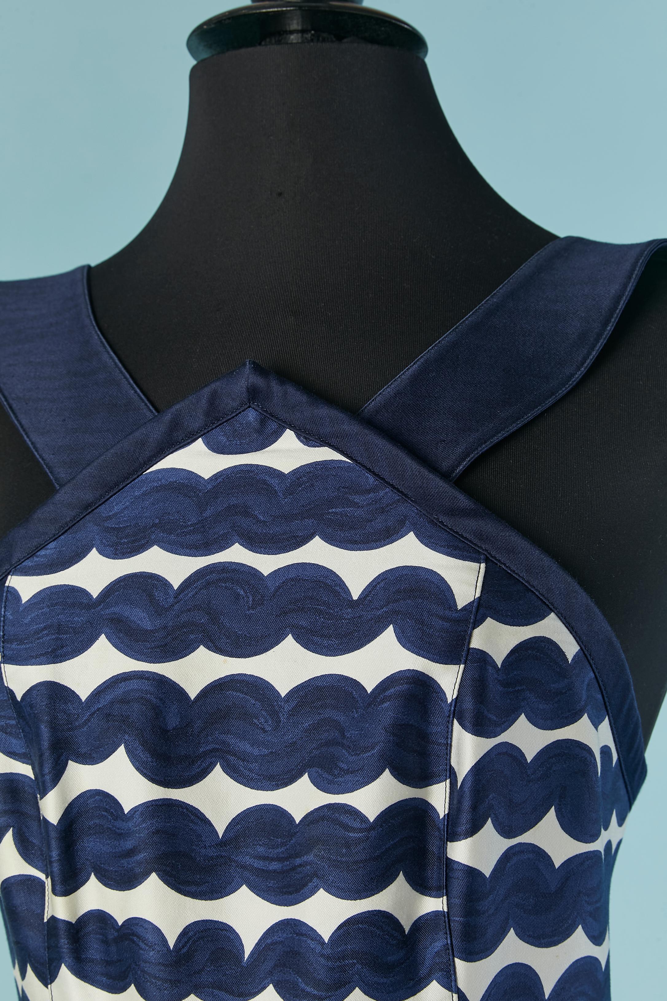 Navy blue and white printed sleeveless evening dress . Main fabric and lining fabric composition: 100% cotton. 
Zip and hook&eye closure on the middle back. Box-pleat on the middle front and fake pockets ( only the pocket flap) Snaps covered in blue