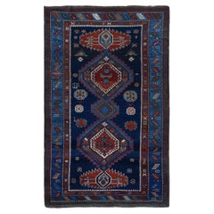 Alfombra antigua azul marino de lana kazaka del Cáucaso anudada a mano, firmada y fechada en 1929