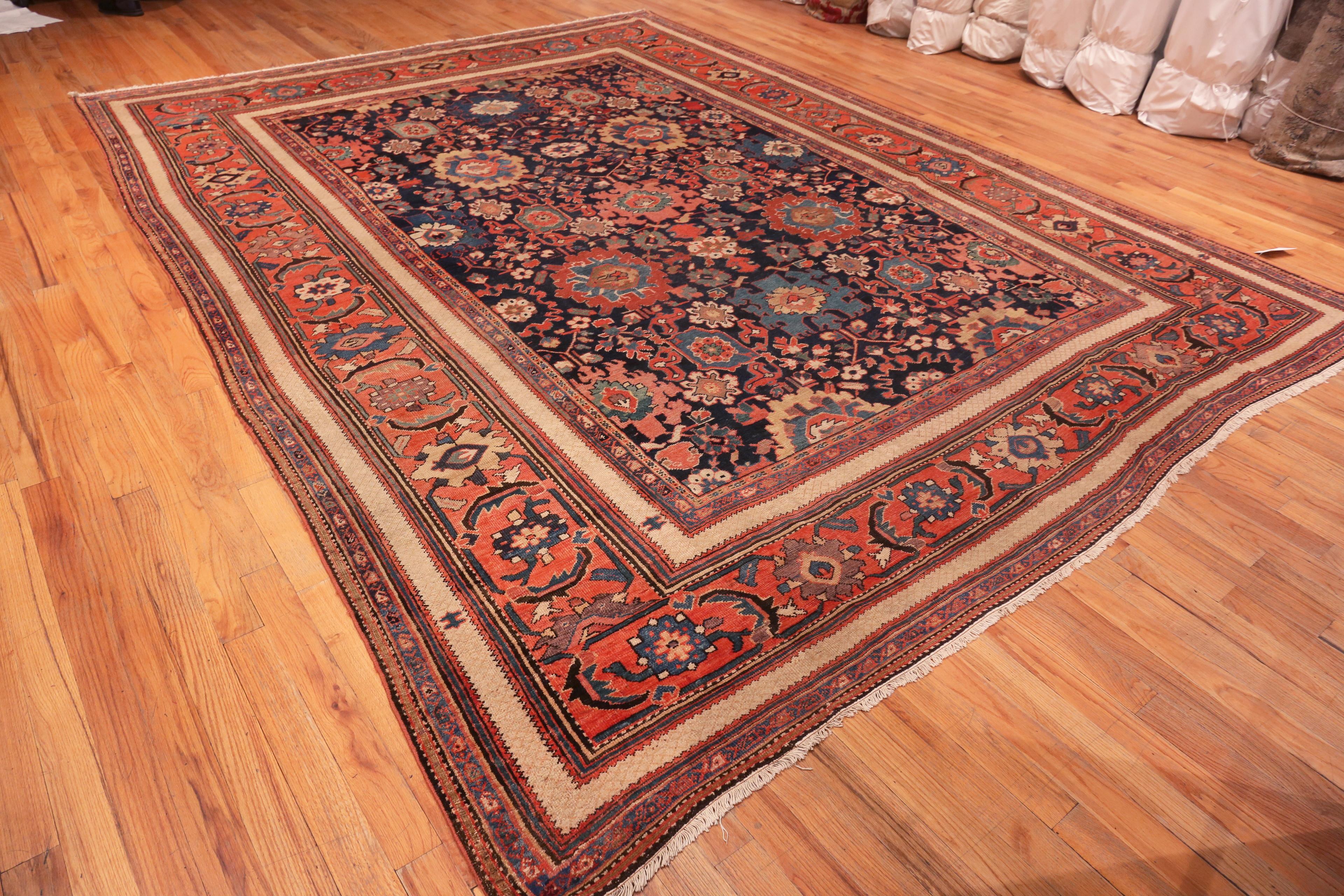 Breathtaking Navy Blue Background Antique Persian Sultanabad Rug, country of Origin/Rug type: Persian rug, Circa date: 1900. Size: 10 ft 8 in x 14 ft 2 in (3.25 m x 4.32 m)