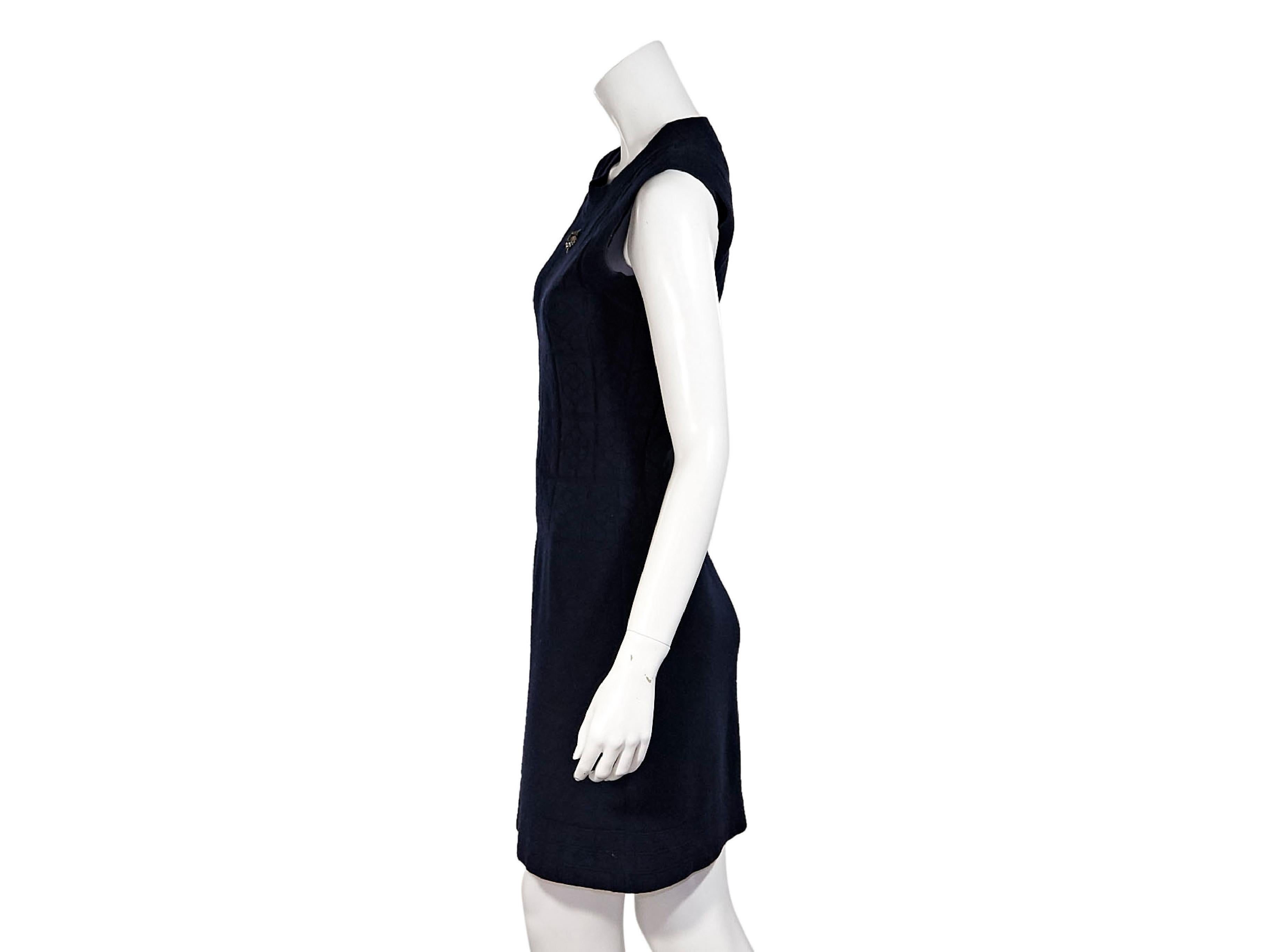 Product details:  Navy blue stretch wool/cashmere-blend knit dress by Chanel.  Crewneck.  Sleeveless.  Goldtone sequin accent at bodice.  Pullover style.  32
