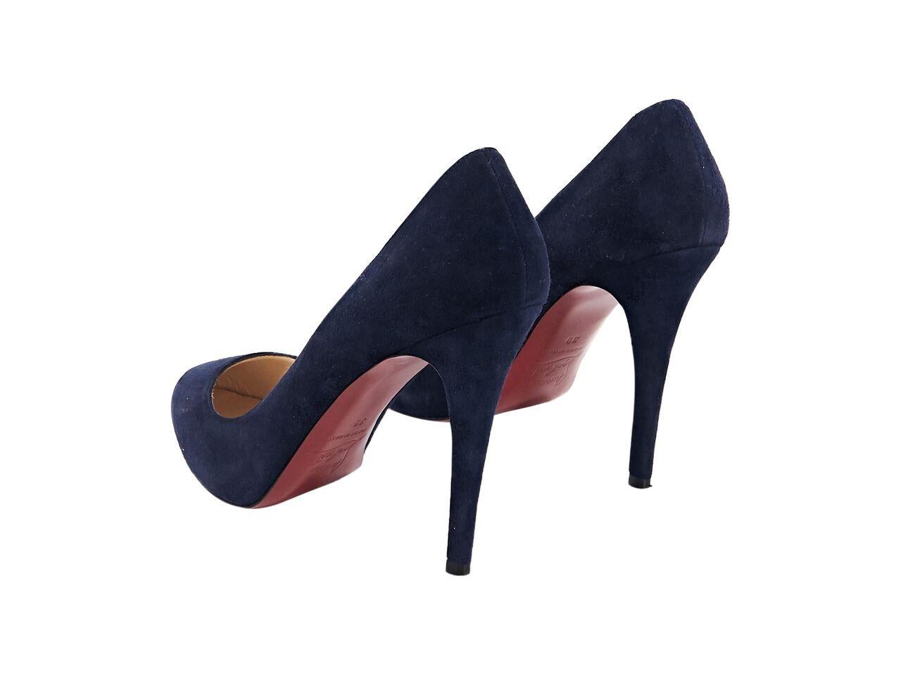 Product details:  Navy blue suede pumps by Christian Louboutin.  Round almond toe.  Iconic red sole.  Slip-on style.  4.5