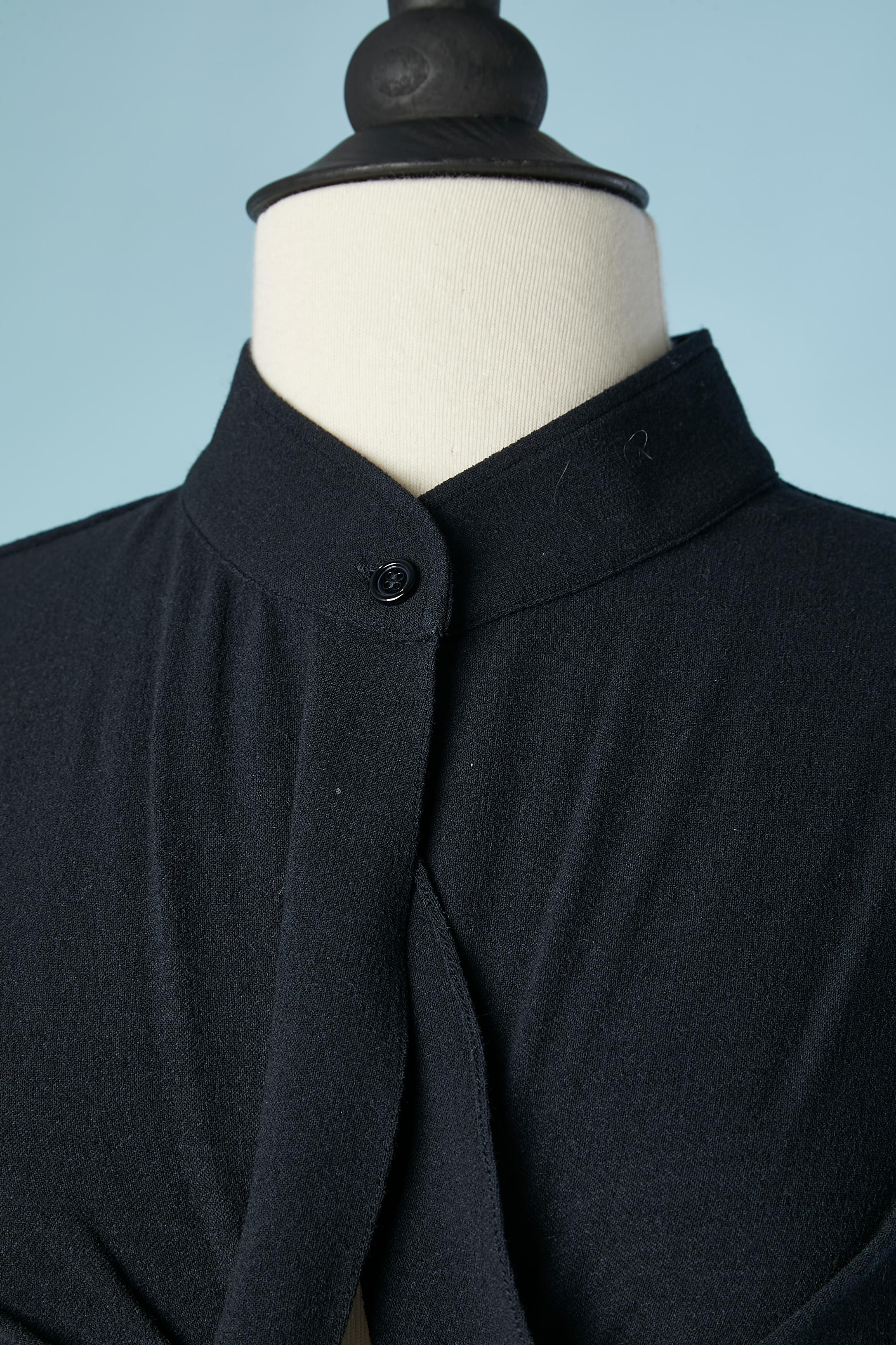 Navy blue cocktail dress in stretch wool with drape ruffles and zip in the middle front . One button and buttonhole in the top middle front. No lining
Fabric composition: 86% wool, 5% elastane, 9% nylon
SIZE 38 (M)