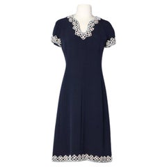 Vintage Navy blue cocktail dress with beaded neckline and sleeves Circa 1960's 