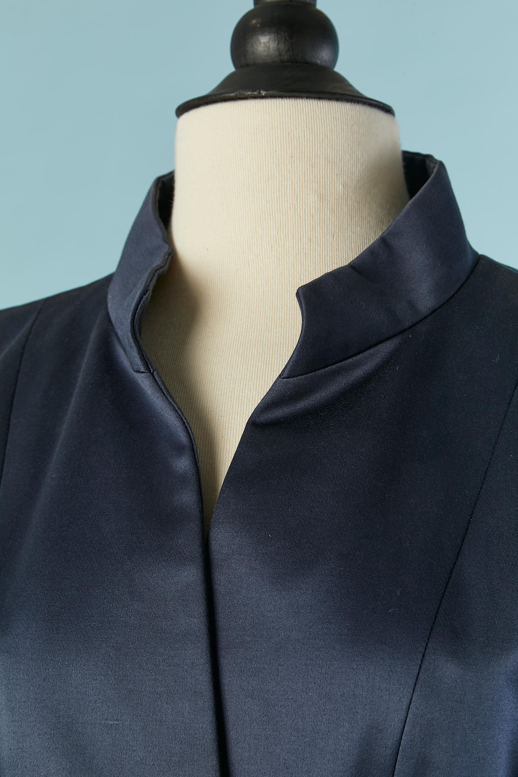 Navy blue cotton skirt-suit . Lining composition: 55% acetate, 45% rayon. 
Shoulder pad. Button closure on the middle front and buttons on the cuffs as well. 
SIZE OF THE JACKET : 38 (Fr) M 
SIZE OF THE SKIRT : 36 (Fr) XS ( very small waist) 