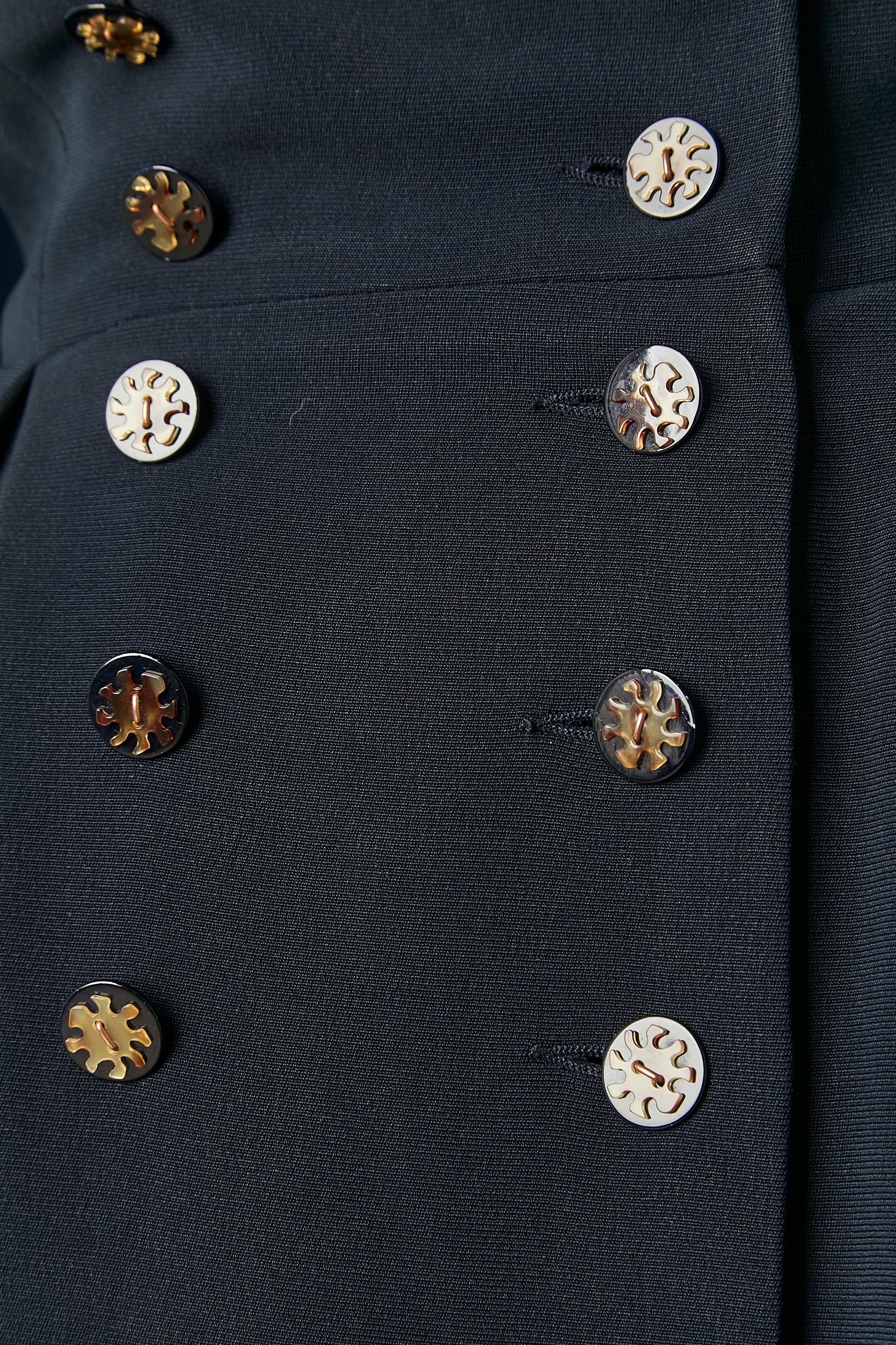 Navy blue double-breasted coat-dress . No fabric composition tag but probably rayon and silk lining. Buttons, buttonhole and 1 hook&eye in the middle front. 
SIZE 42 (Fr) 12 (Us) L 