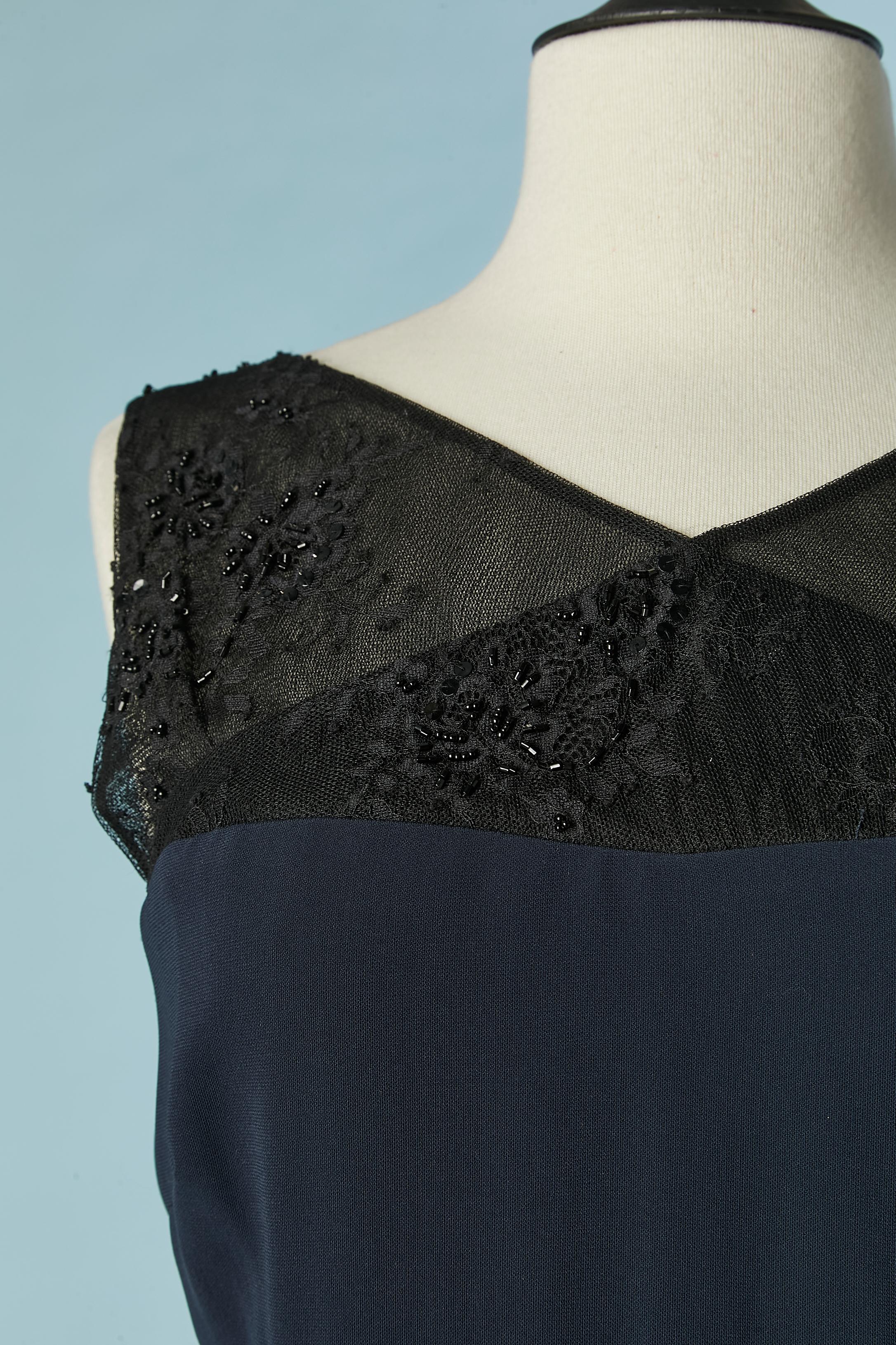 Navy blue evening dress with black lace, sequin and beads inset. Main fabric composition: 71% triacetate, 29% polyester. Silk lining. See-through on the side, back and shoulders. 
Zip and hook&eye closure in the middle back. 
Total front lenght= 150