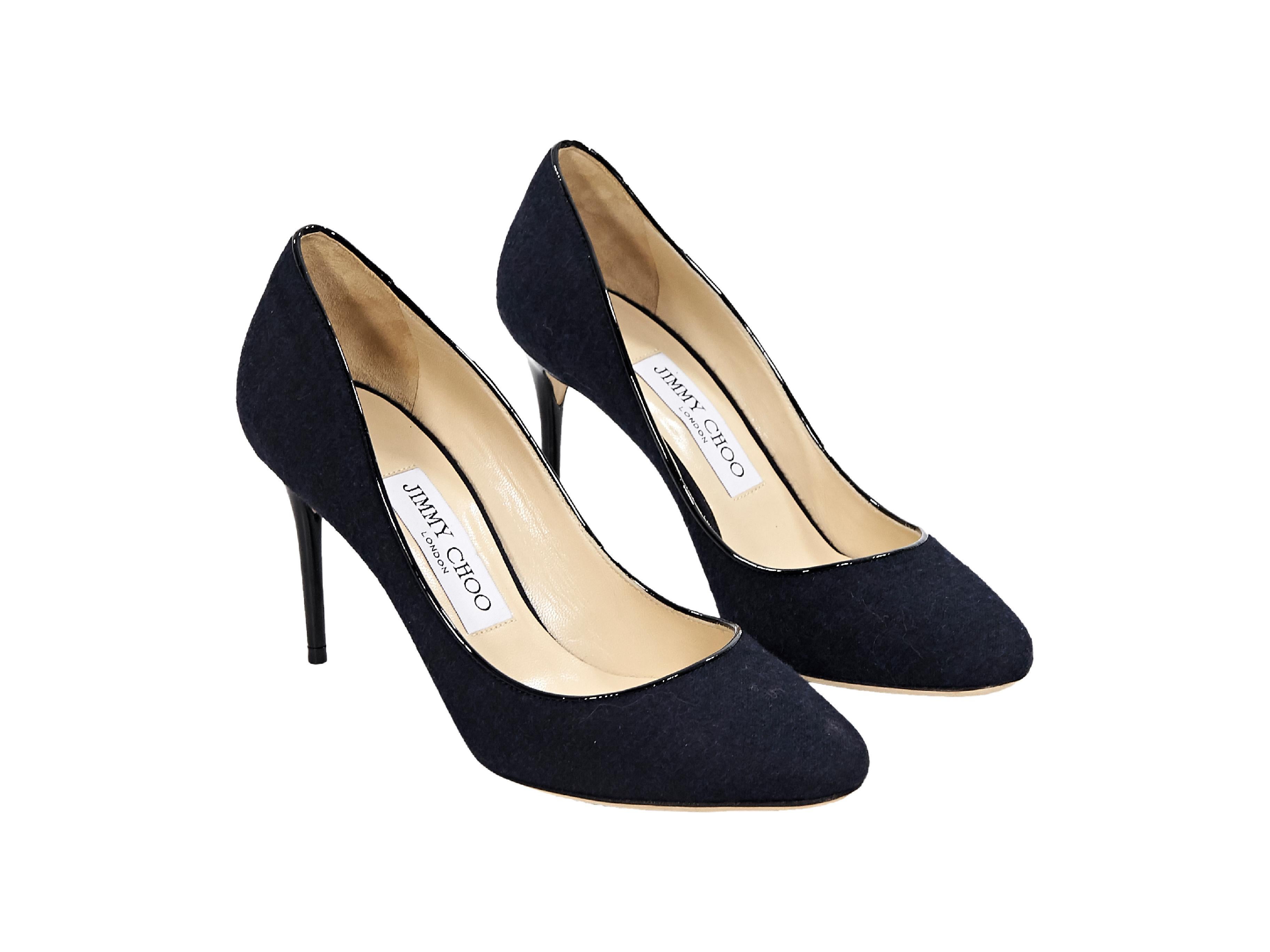 Product details:  Navy blue cashmere pumps by Jimmy Choo.  Round toe.  Leather-wrapped stiletto heel.  Slip-on style.  3.5