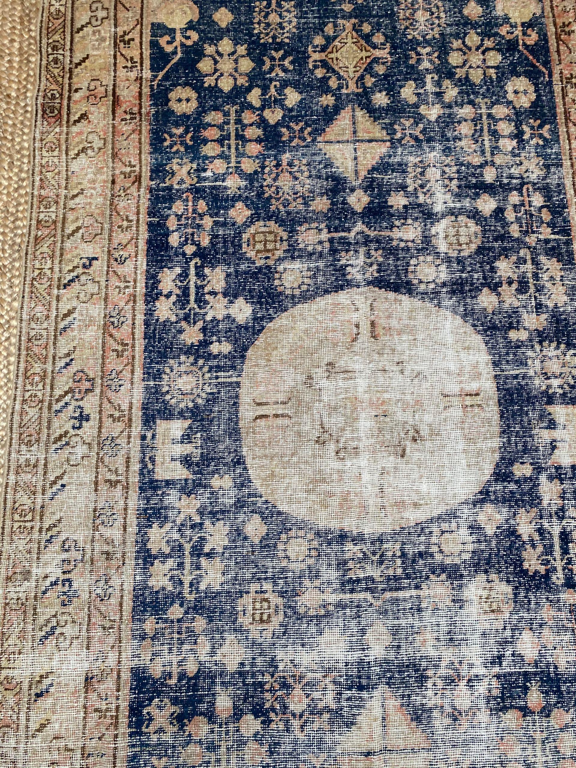 Orgin: Turkey
Dimensions: 11' x 5’8?
Age: 1920’s
Design: Khotan
Material: 100% Wool-pile
Color: Navy Blue, Beige, Brown

9371

An epitome of history, character and culture, Antique Khotan rugs add richness to a room. Produced in Khotan, an