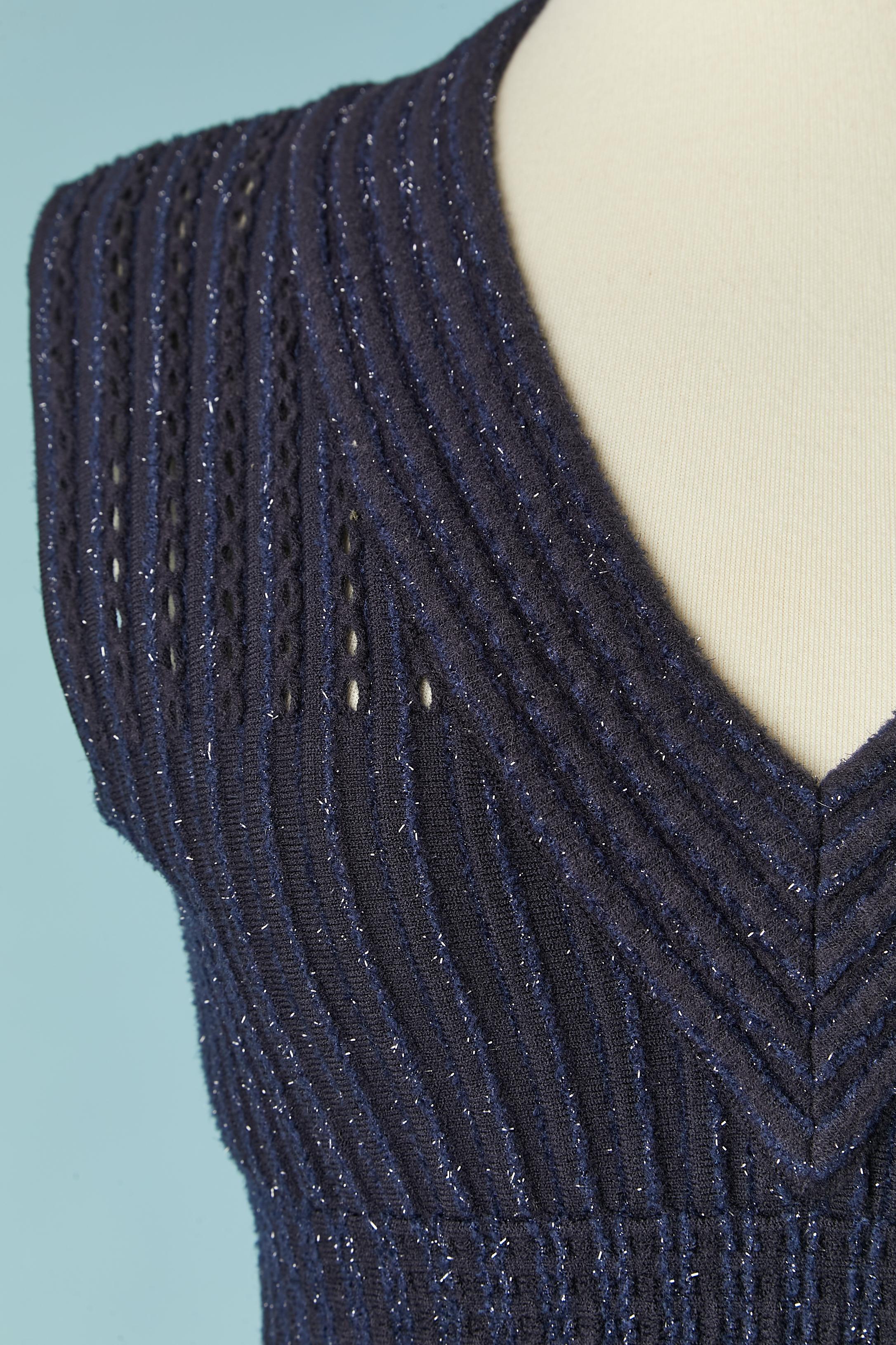 Navy blue knit and lurex threads sleeveless see-through cocktail dress. Knit composition: 60% wool, 20% polyamide, 10% rayon, 10% polyester. 
Zip closure in the middle back. 
SIZE 38( It) 34 (Fr) XS 