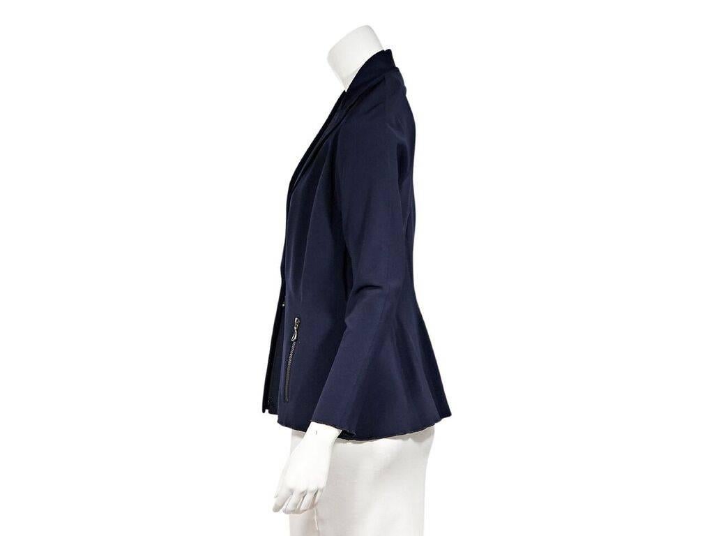 Product details:  Navy blue blazer by Lanvin.  Peaked lapel.  Long sleeves.  Concealed zip-front closure.  Waist zip pockets.  38