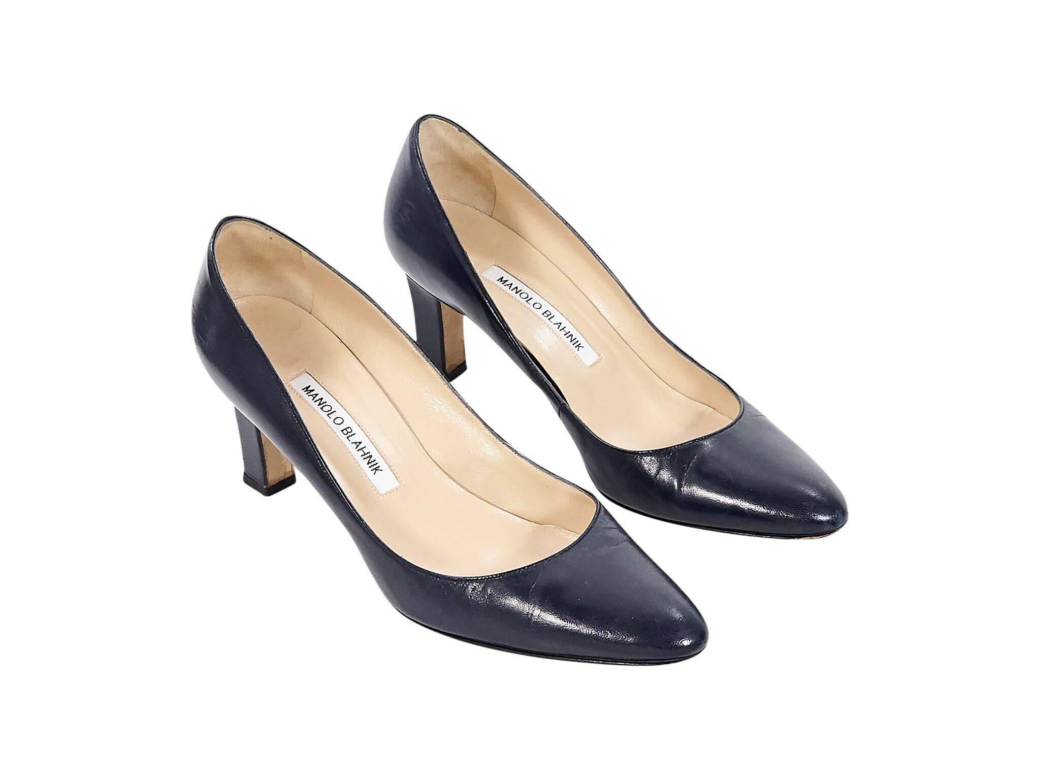 Product details:  Navy blue leather pumps by Manolo Blahnik.  Round toe.  Slip-on style. 
Condition: Pre-owned. Very good. 
Est. Retail $430