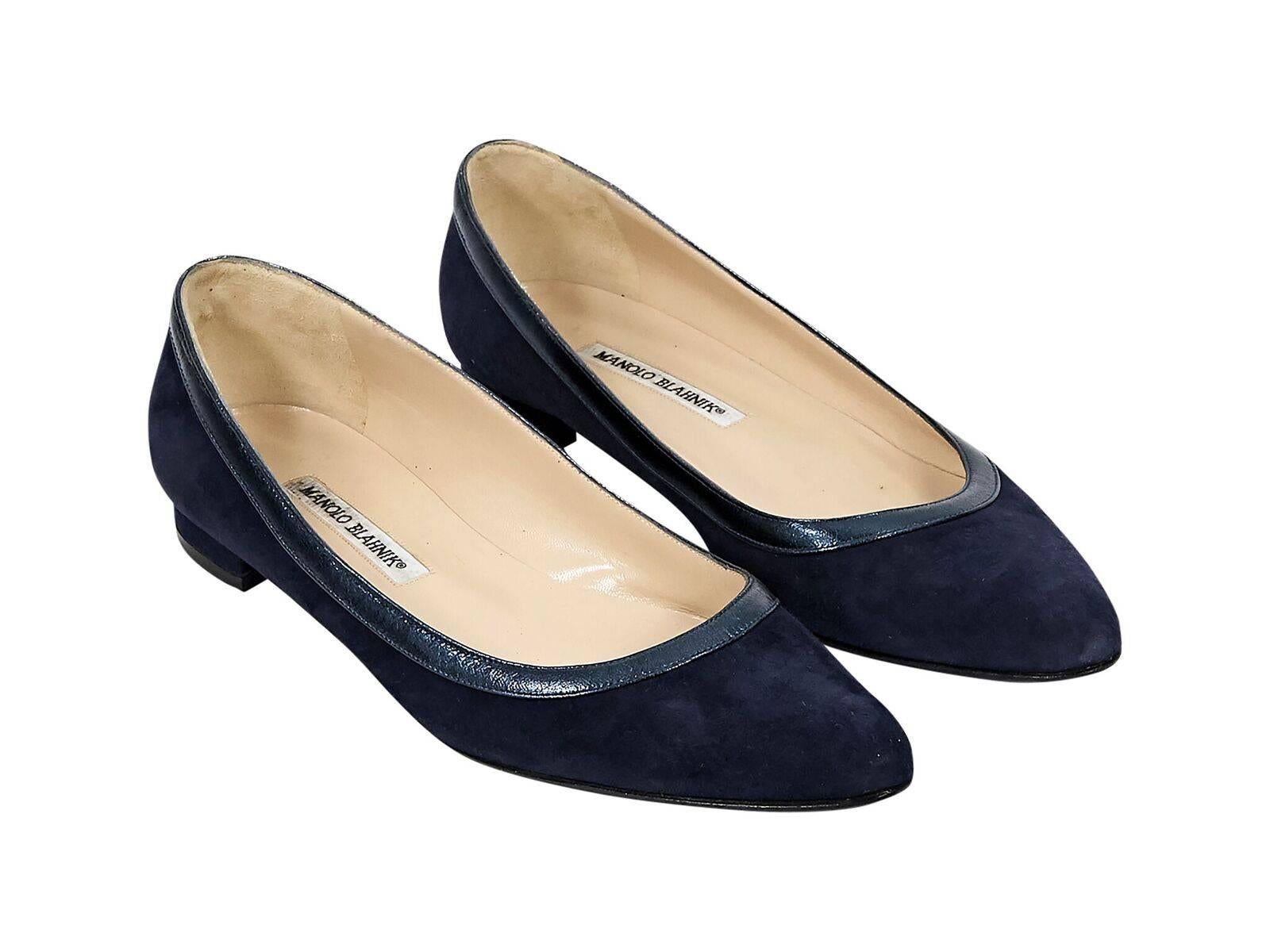 Product details:  Navy blue suede flats by Manolo Blahnik.  Trimmed with metallic blue leather.  Round toe.  Slip-on style. 
Condition: Pre-owned. Very good.
Est. Retail $298