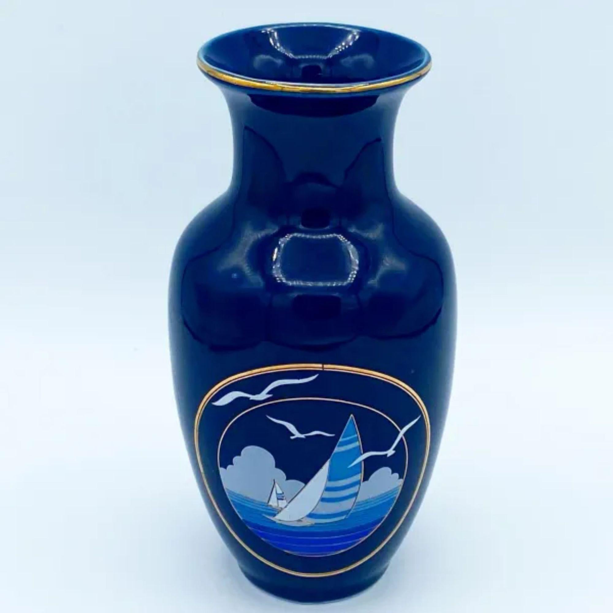Depicts sailboats at sea with pelicans and clouds on the horizon.

Additional information: 
Material: Porcelain
Color: Blue
Style: Mid-Century, Vintage
Brand: Jordan’s
Time Period: 1960s
Place of origin: Japan
Dimension: 3” L x 3” D x 6.25” H