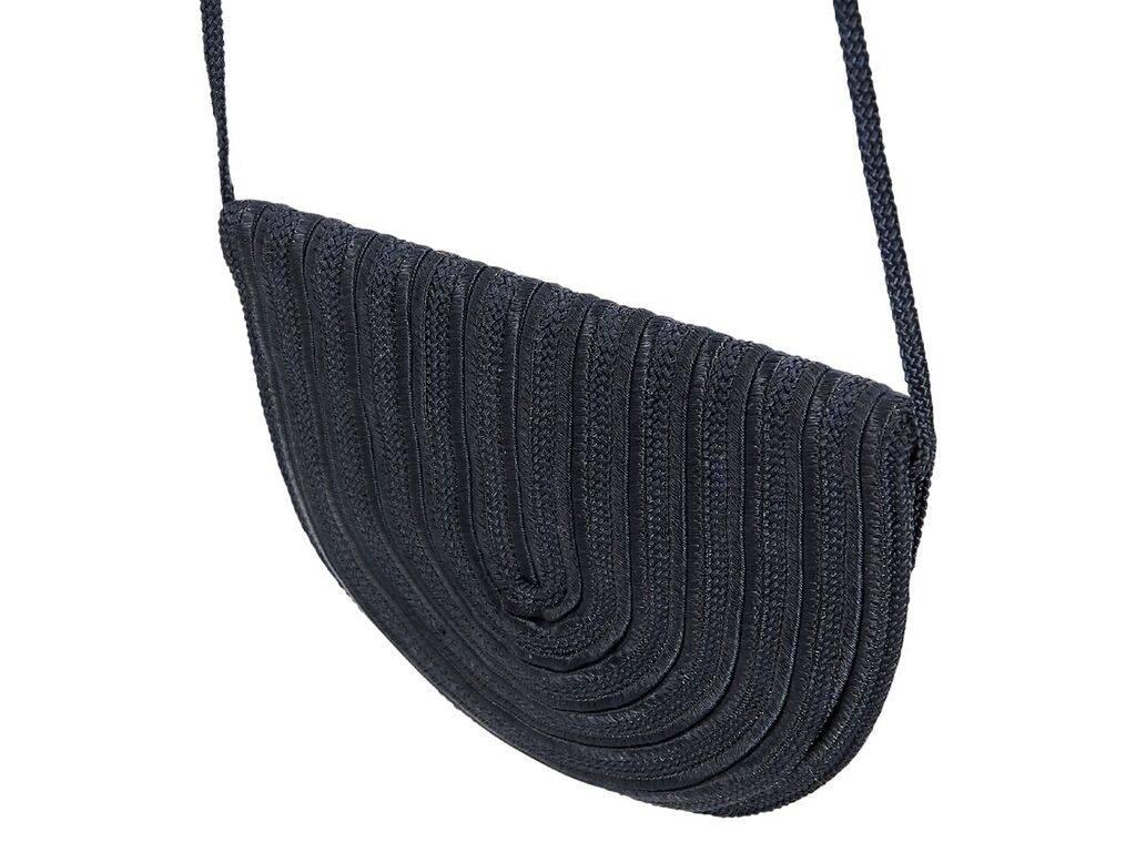 Product details:  Vintage navy blue rope clutch by Nina Ricci.  Tuck-away crossbody strap.  Front flap accented with a bow.  Concealed magnetic snap closure.  7.5