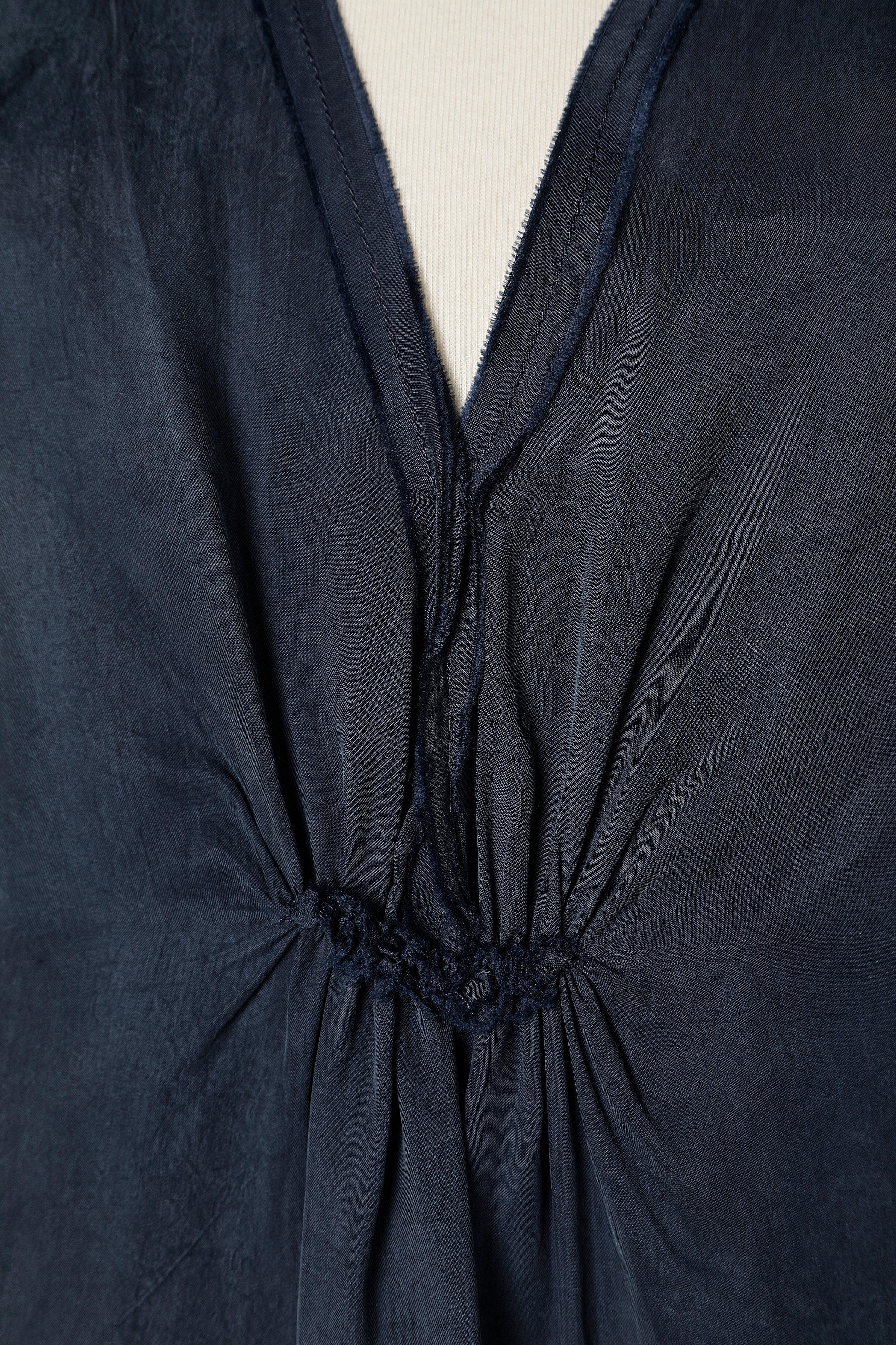 Navy blue row cut dress draped in the middle front and on the shoulders. The fabric is called Cupro but looks like washed silk. 
Split in the middle front =20 cm