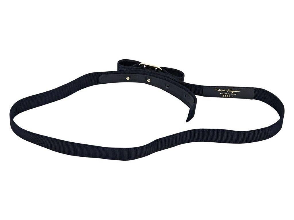 Product details:  Navy blue grosgrain Vara bow belt by Salvatore Ferragamo.  Adjustable buckle closure.  Goldtone hardware.  1