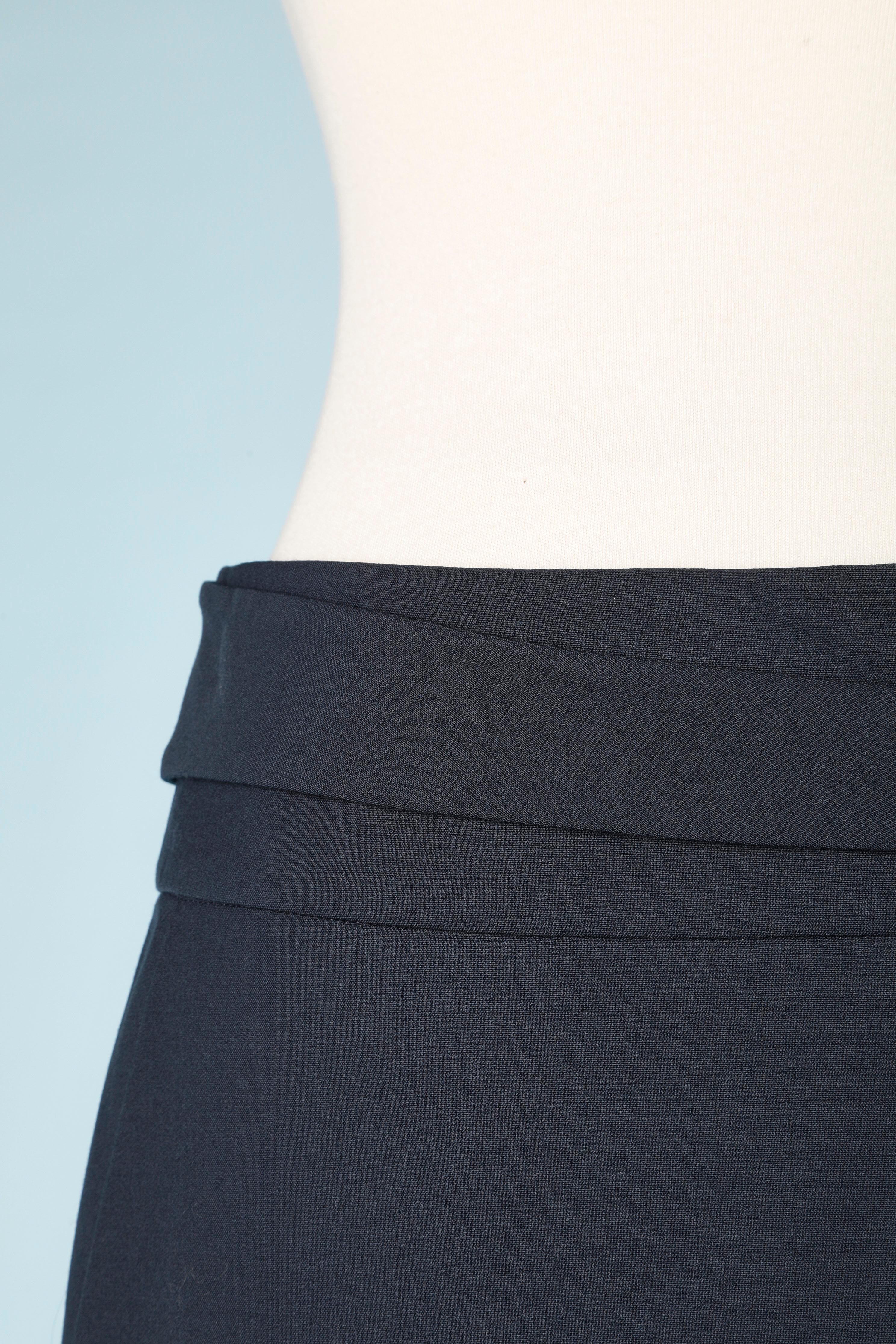 Navy blue thin wool skirt with wrap fabric belt . ( the belt is a part of the waist band, start on the left side, then go along the back and come back from the right side to get attached on a hook&eye on the middle front) Hidden button and