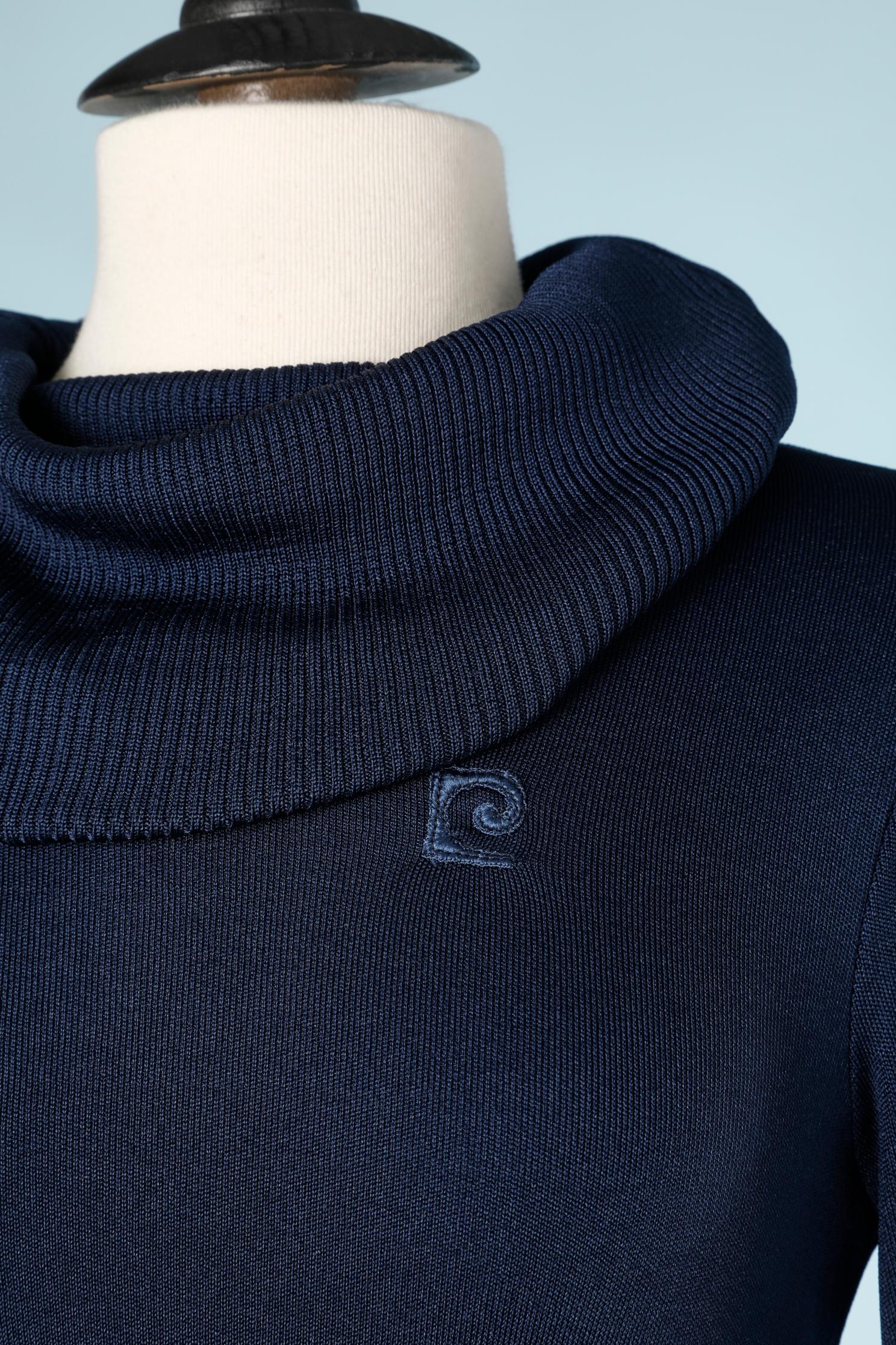 Navy blue turtle neck sweater. No fabric tag but probably nylon or acrylic. 
SIZE S 