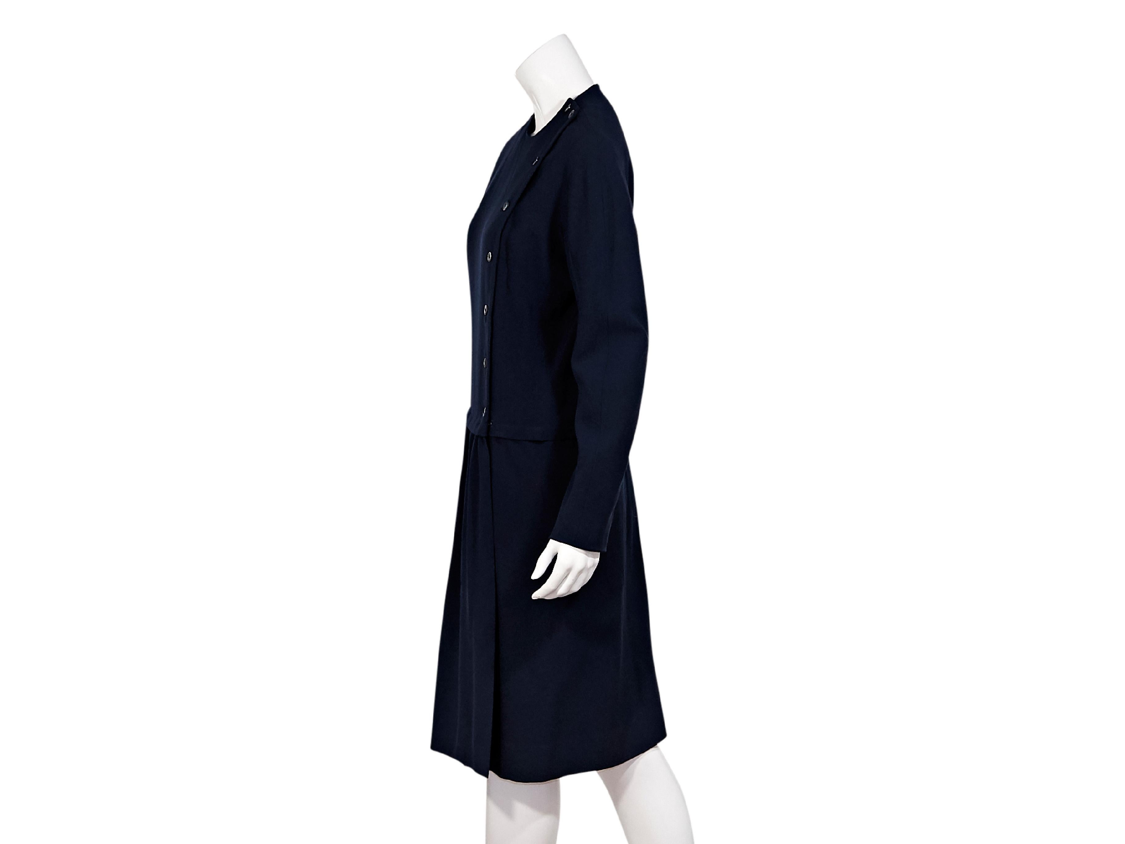 Product details:  Vintage navy blue wool dress by Hermes.  Crewneck.  Long sleeves.  Asymmetrical button-front closure.  40