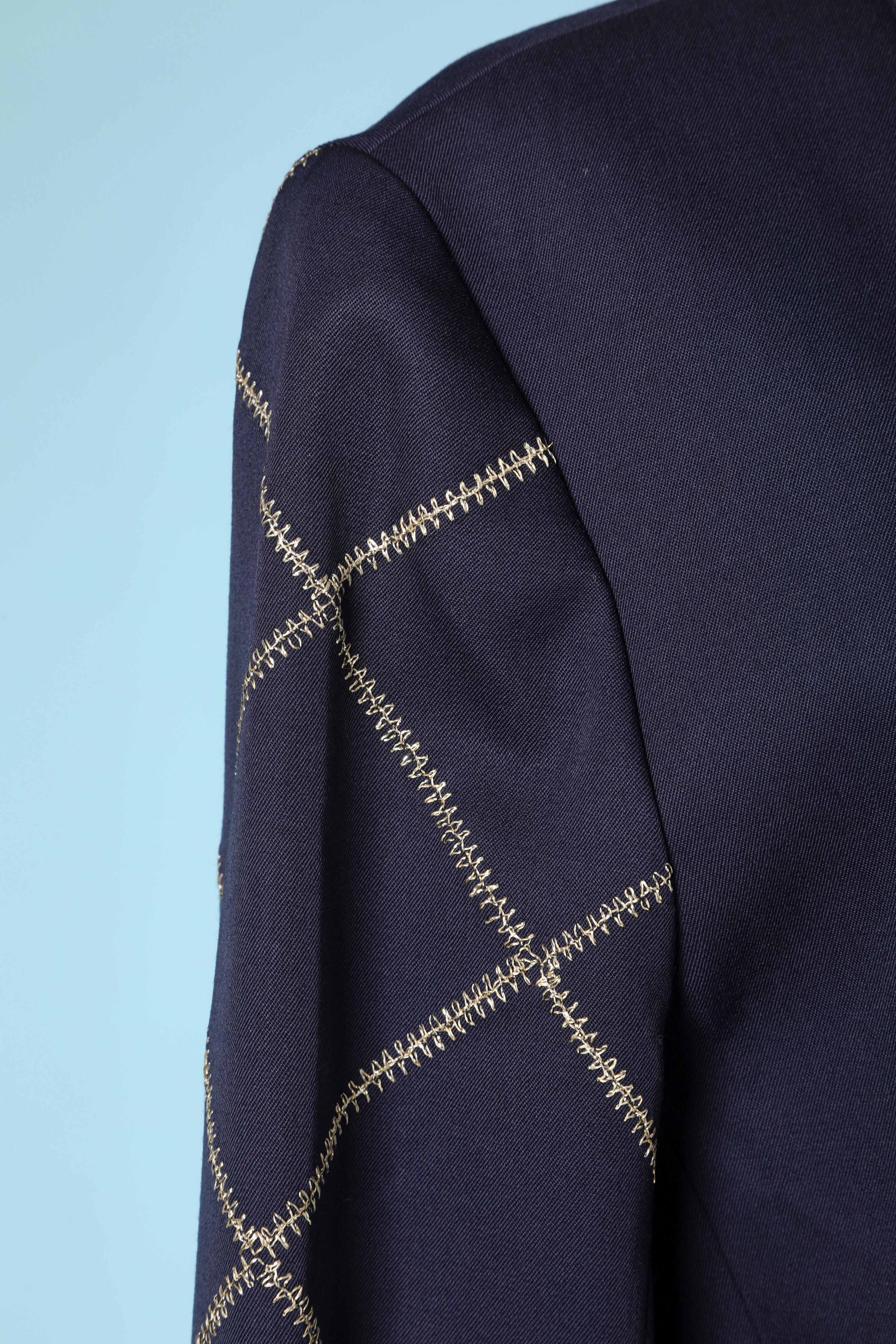 Blazer en laine bleu marine à double boutonnage avec surpiqûres en lurex doré sur les bras